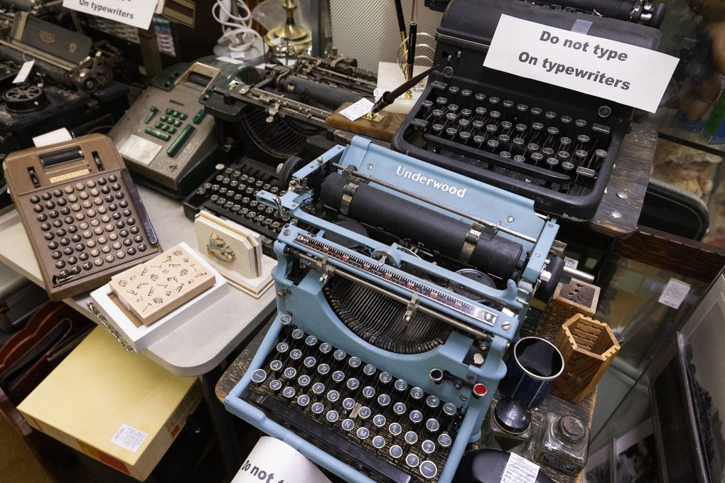 Typewriters and registers are seen at the Antique Mall of West Seattle, Sunday, Aug. 2, 2026. (Ken Lambert / The Seattle Times)