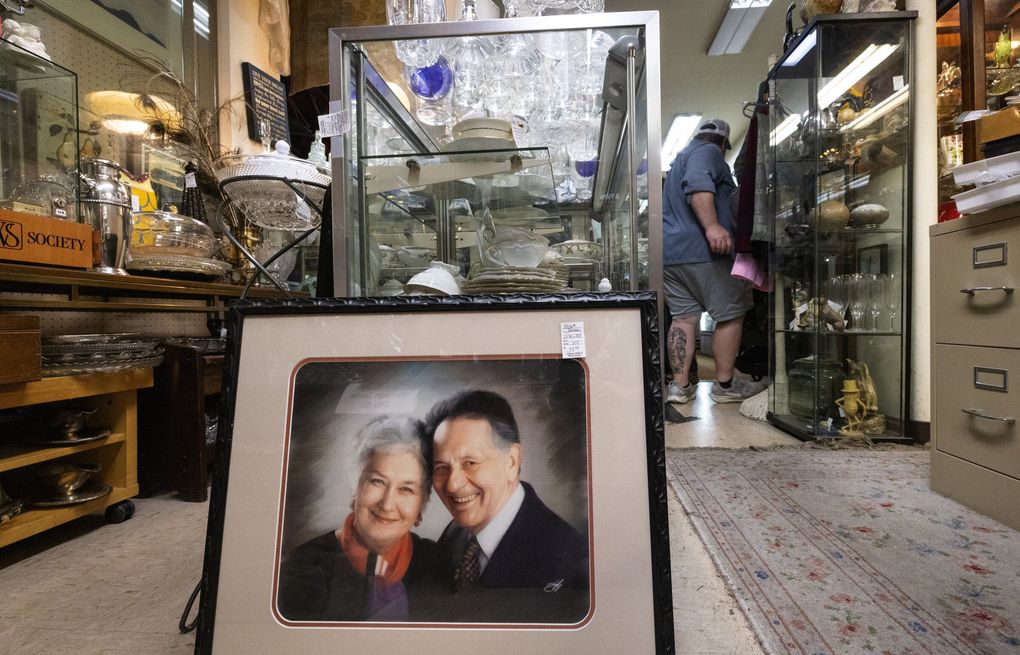 A “nice frame” for $39.50 and a tight squeeze for customers are all part of the experience at the Antique Mall of West Seattle, Sunday, Aug. 2, 2026, which has been a shopping destination for over 20 years. (Ken Lambert / The Seattle Times)
