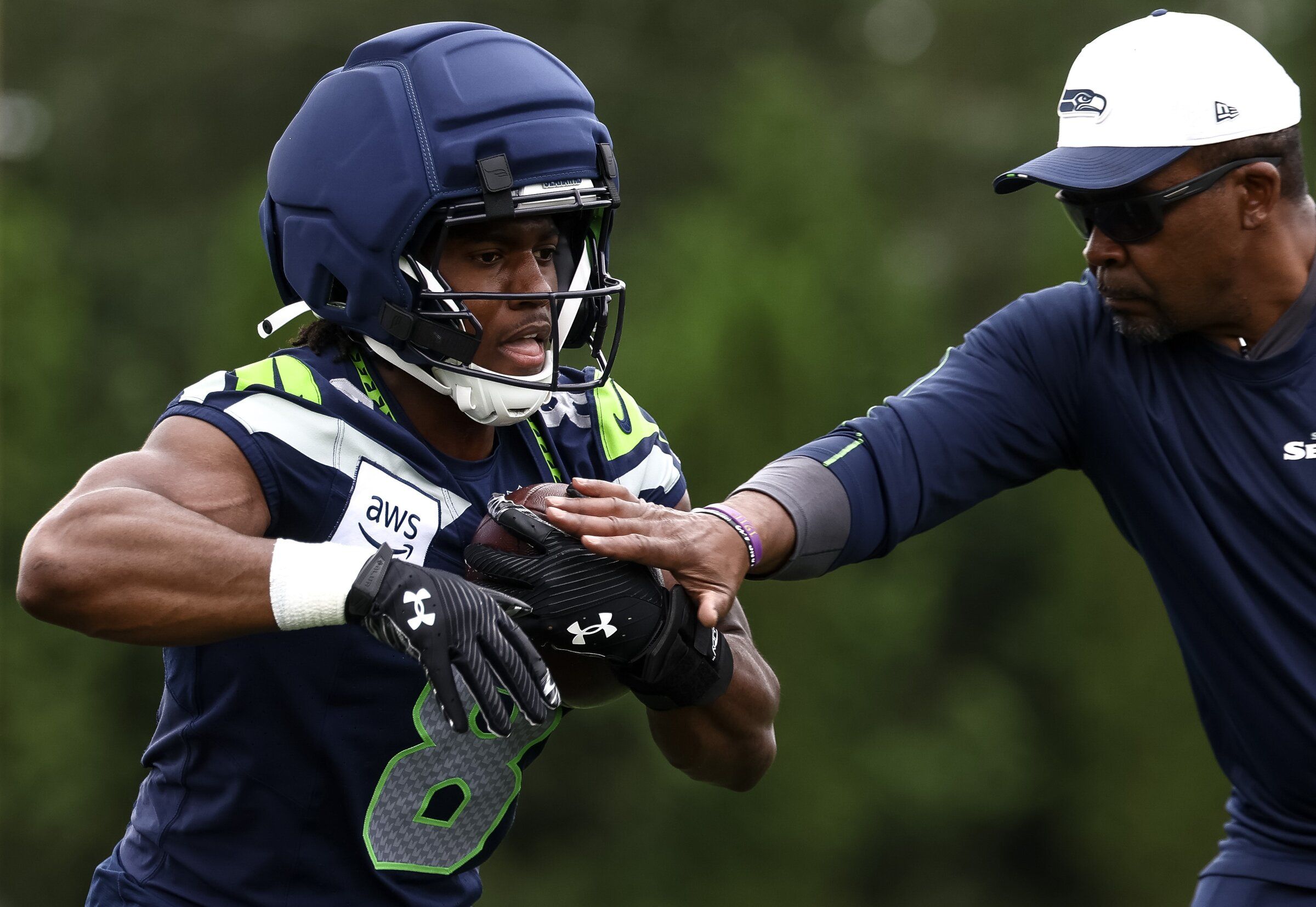 Seahawks rookie running back Jadarian Price participates in a drill during OTAs in June. (Nick Wagner / The Seattle Times)