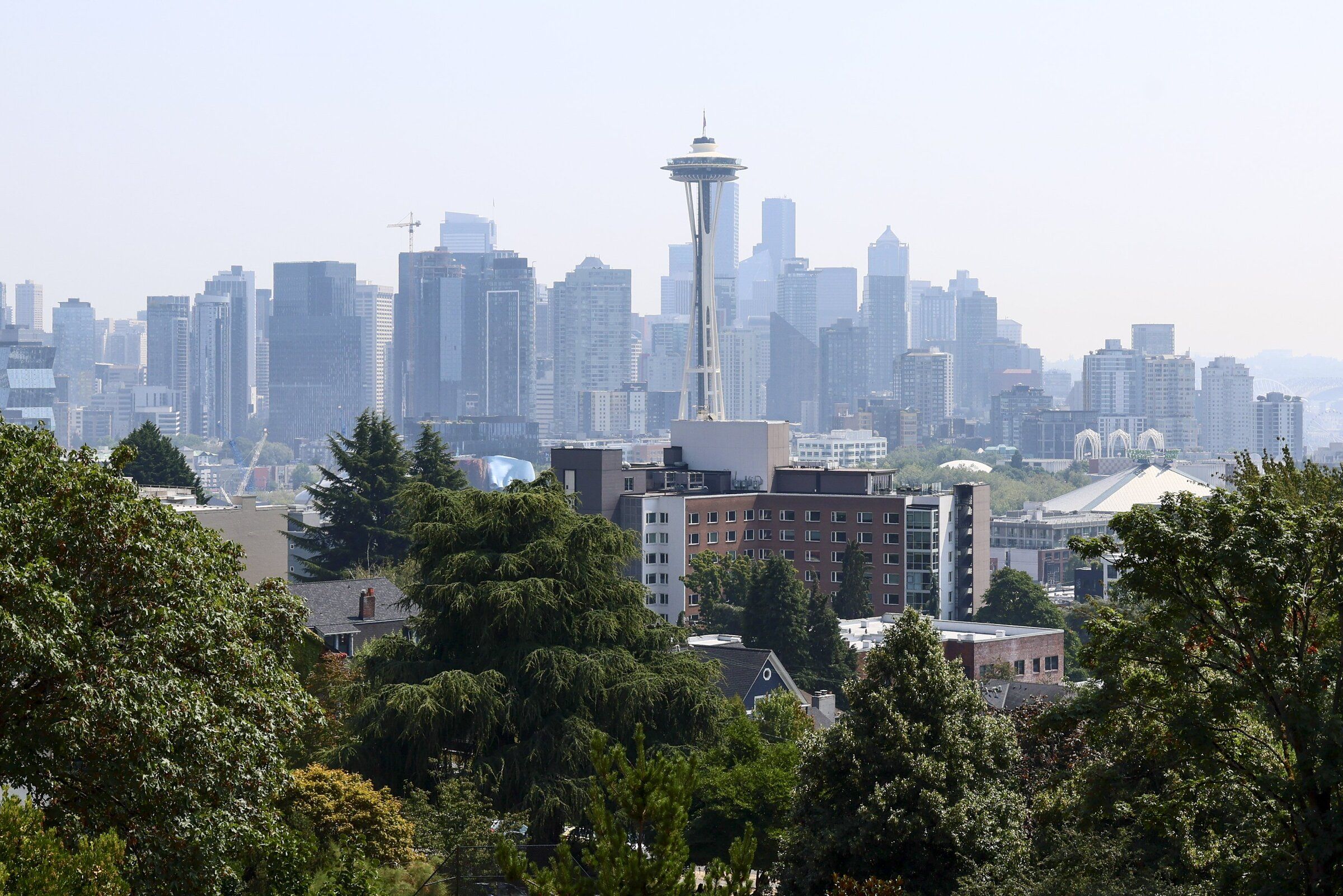 Seattle’s skyline remained hazy Thursday due to lingering wildfire smoke. (Kevin Clark / The Seattle Times)