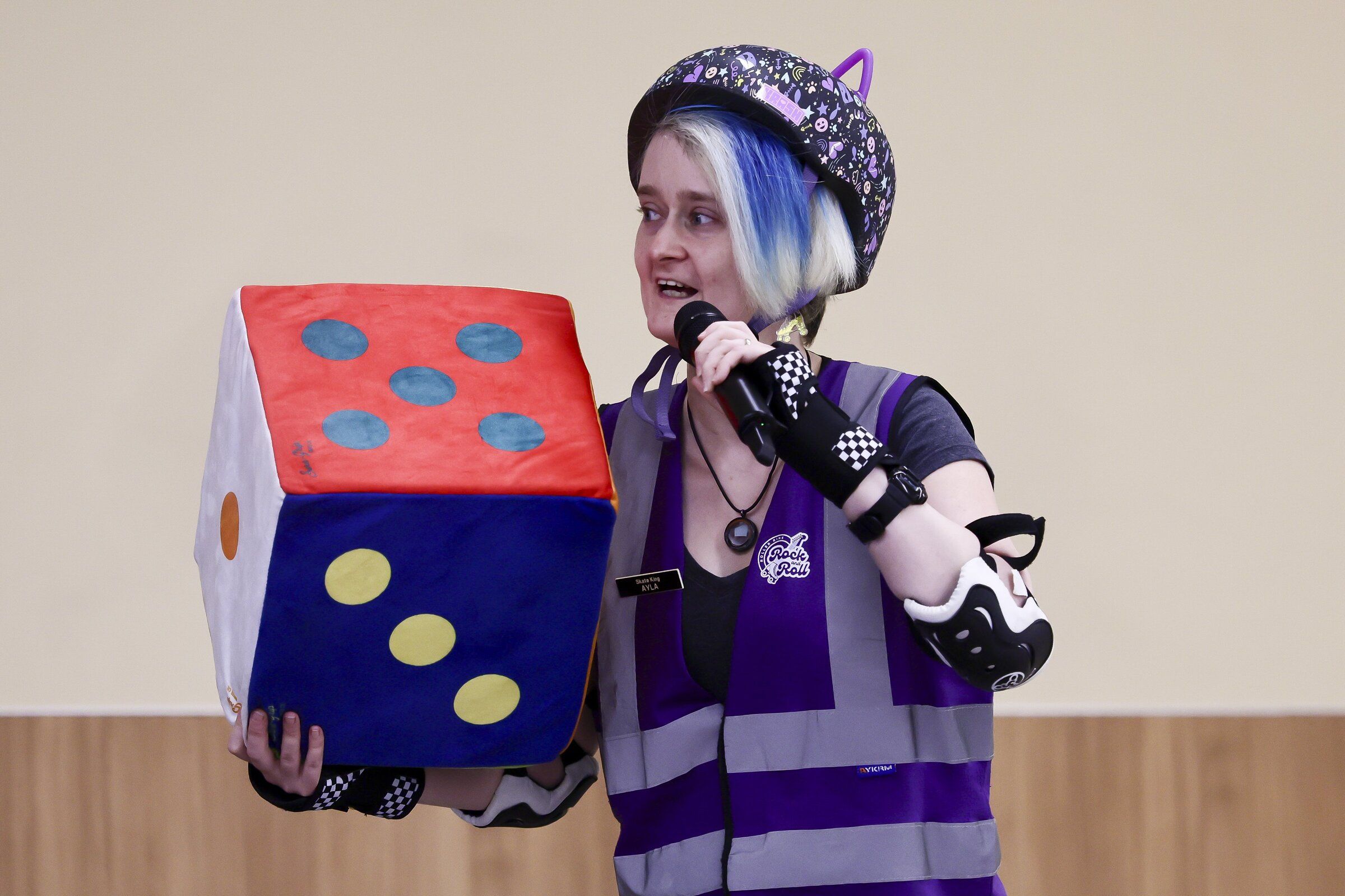 Ayla Webb leads a game Friday afternoon at the roller rink. (Kevin Clark / The Seattle Times)