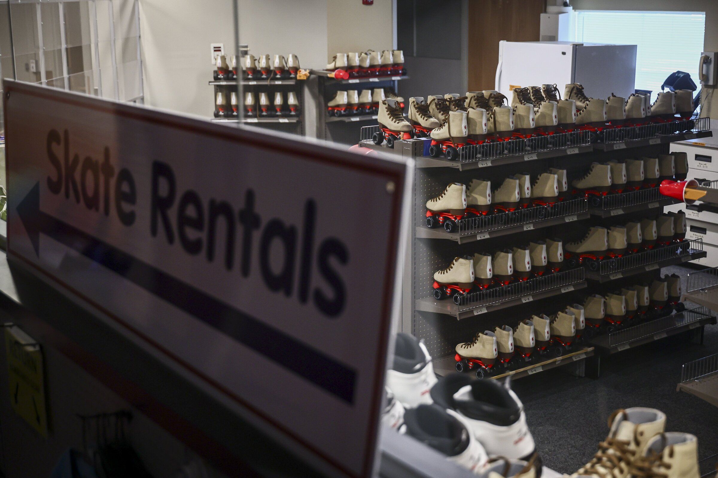 Skates await rental at the former drugstore retail space that has now been turned into a roller rink. (Kevin Clark / The Seattle Times)