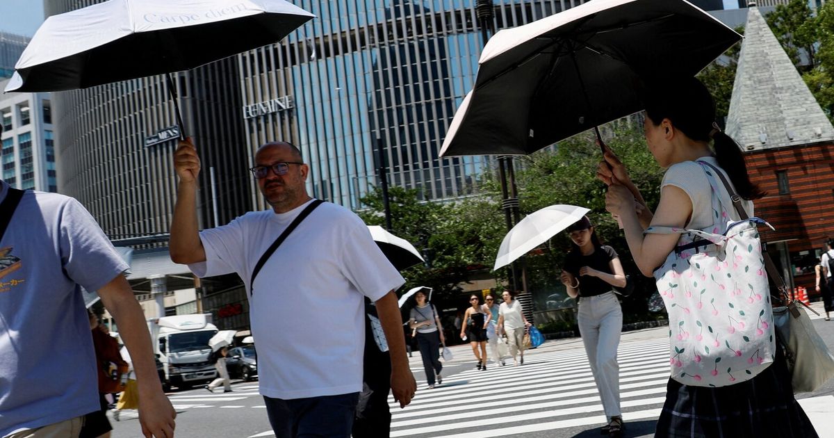 AC vests and UV parasols: East Asia deploys heat-fighting gadgets