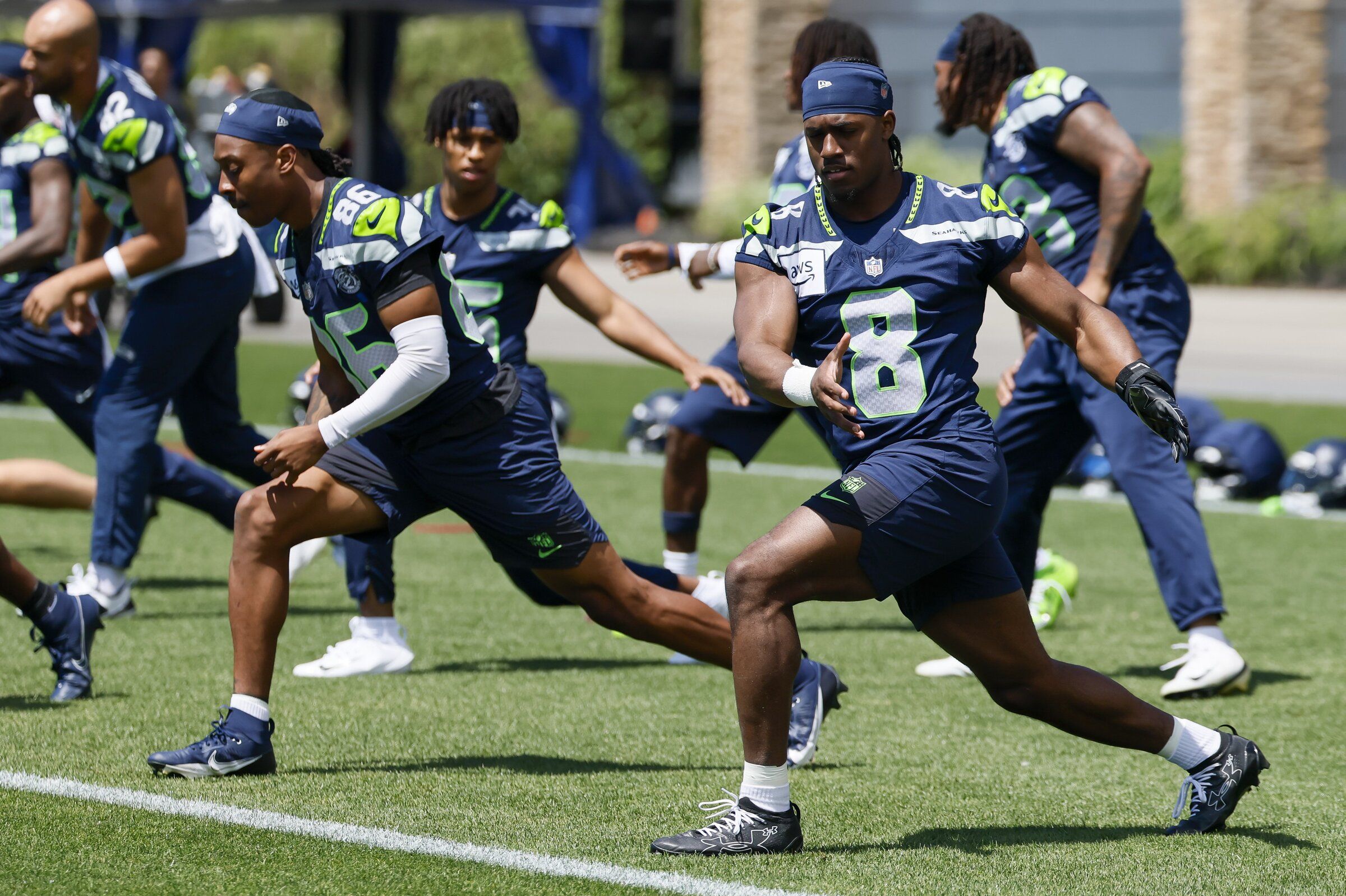 Seattle Seahawks running back Jadarian Price stretches on the first day of minicamp on Tuesday, June 9, 2026, in Renton. (Jennifer Buchanan / The Seattle Times)