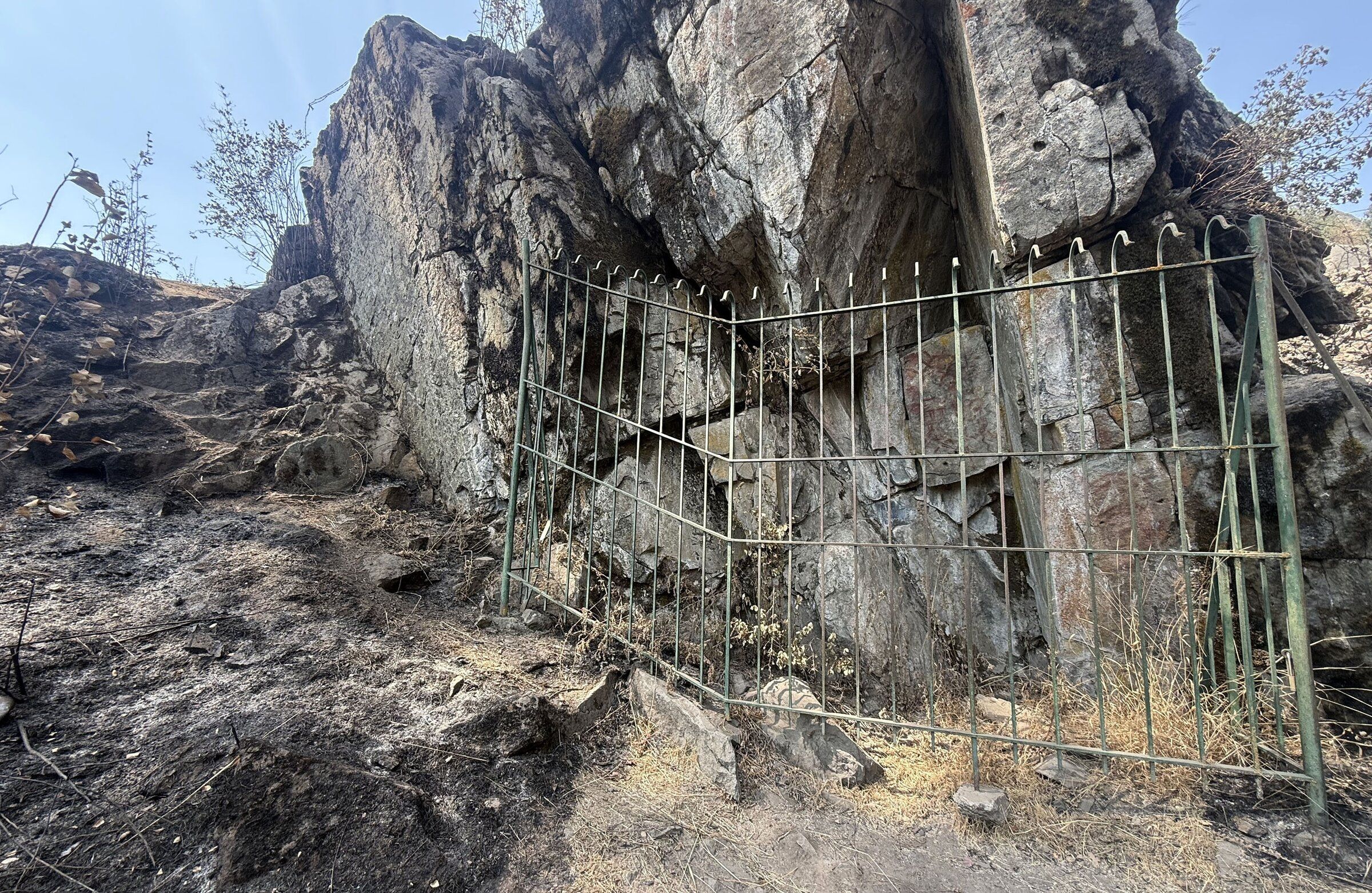 Fire burned up to the Indian Painted Rocks in the Little Spokane Natural Area earlier this month, but the painting remains visible. (Nick Gibson/The Spokesman-Review)