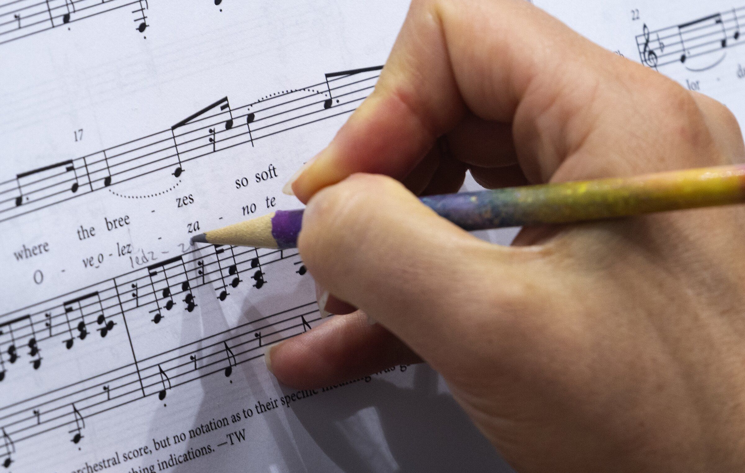 A member of the veterans choir organized by Seattle Opera and Path with Art makes notes in the music during a rehearsal on Aug. 6. (Ken Lambert / The Seattle Times)