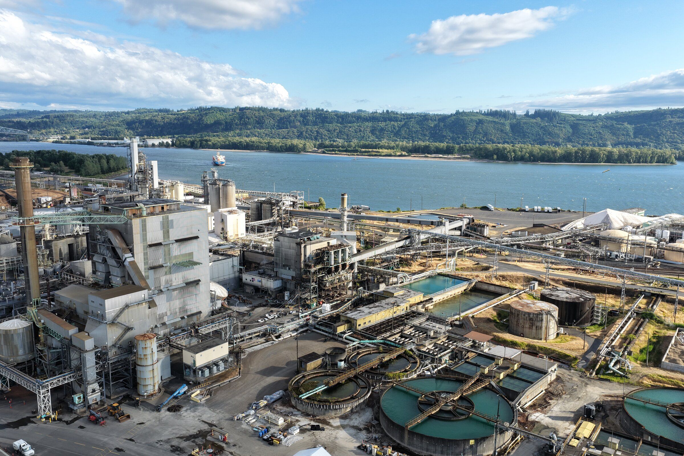 Updated aerial views of the tank that imploded at Nippon Dynawave Packaging Co. last May, in Longview, on Saturday, July 11, 2026. 11 workers were killed at Nippon Dynawave when a tank filled with a chemical liquid imploaded at the end of May. (Karen Ducey / The Seattle Times)