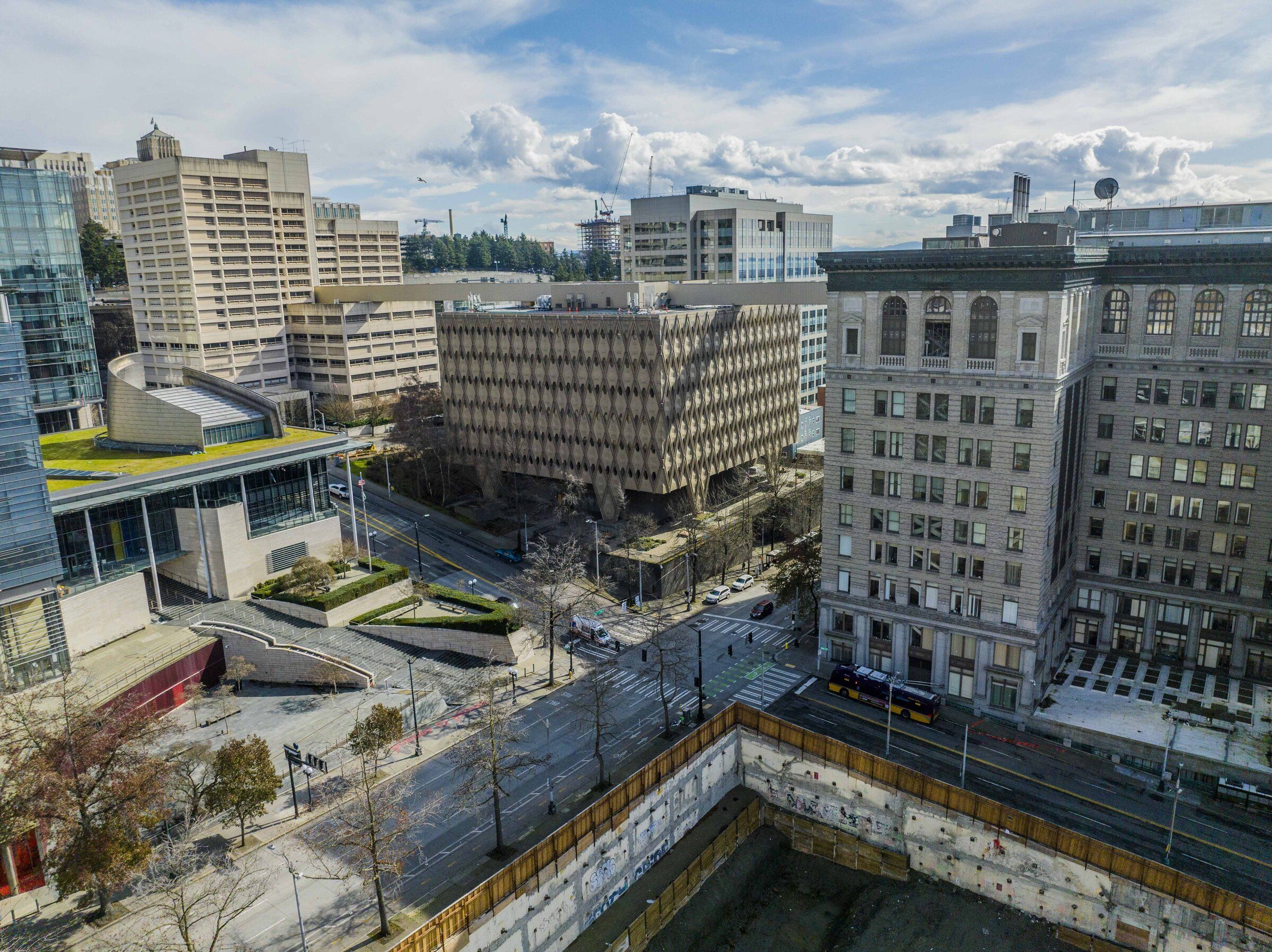 The King County Administration Building, center, will soon reopen to county workers, as Executive Girmay Zahilay struggles to find enough space for employees to return to the office three days a week. From right, is the King County Courthouse, the Administration Building and the King County Correctional Facility. (Daniel Kim / The Seattle Times, 2023)