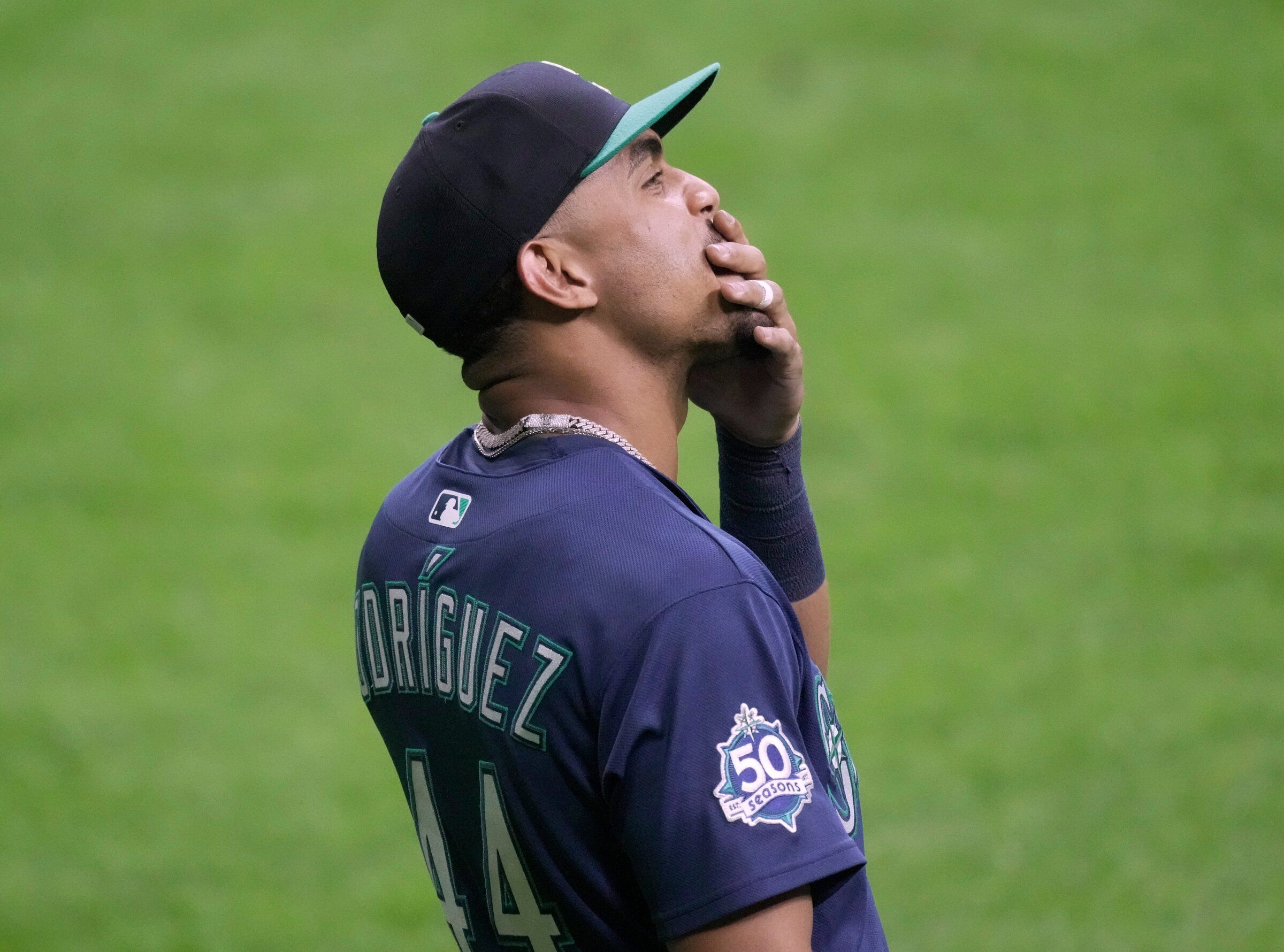 Mariners center fielder Julio Rodríguez reacts after catching a sacrifice fly and tossing the ball into the stands for a fielding error during the eighth inning against the Milwaukee Brewers Tuesday night in Milwaukee. The Mariners lost, 22-0. (Mark Hoffman / Milwaukee Journal / USA Today Network via Reuters)
