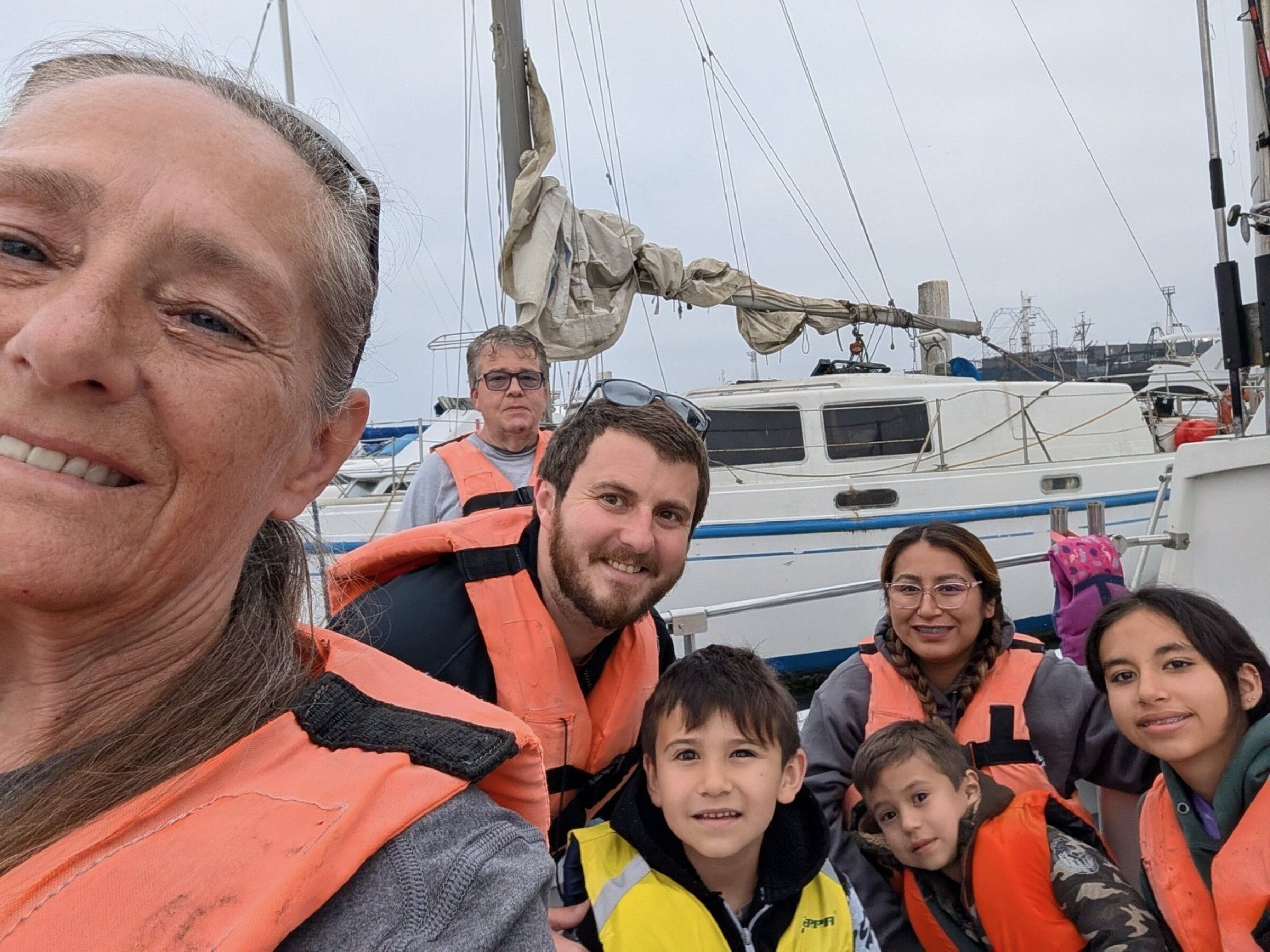 Vincent Short, a Washington man who died aboard a commercial fishing vessel in Alaska last month, poses for a photo with his stepmother Vanessa Brower, left, his wife Adriana Gonzalez, center right, and their three children. (Courtesy of the family)