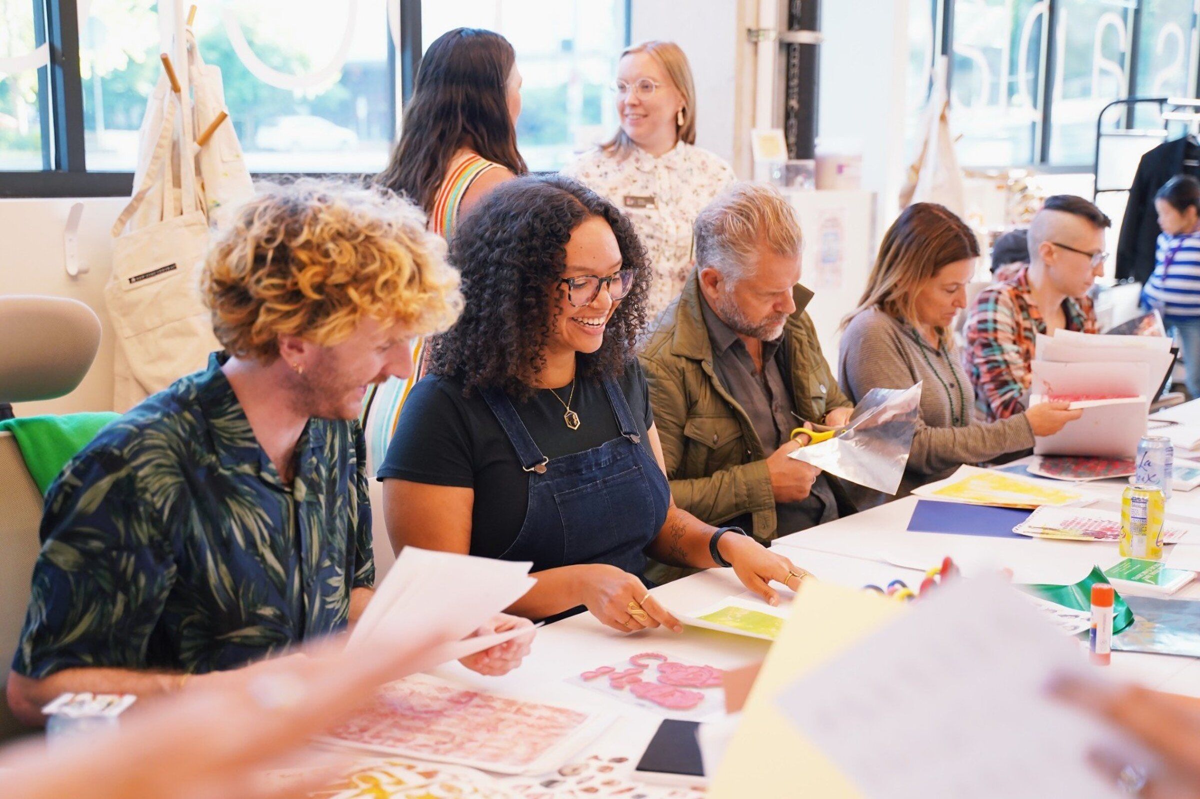 Path with Art participants during a group visual arts class in Seattle. The nonprofit provides trauma-informed arts programming to people working to create stability in their lives after traumatic events or when grappling with crises in mental and behavioral health. (Courtesy Path with Art)
