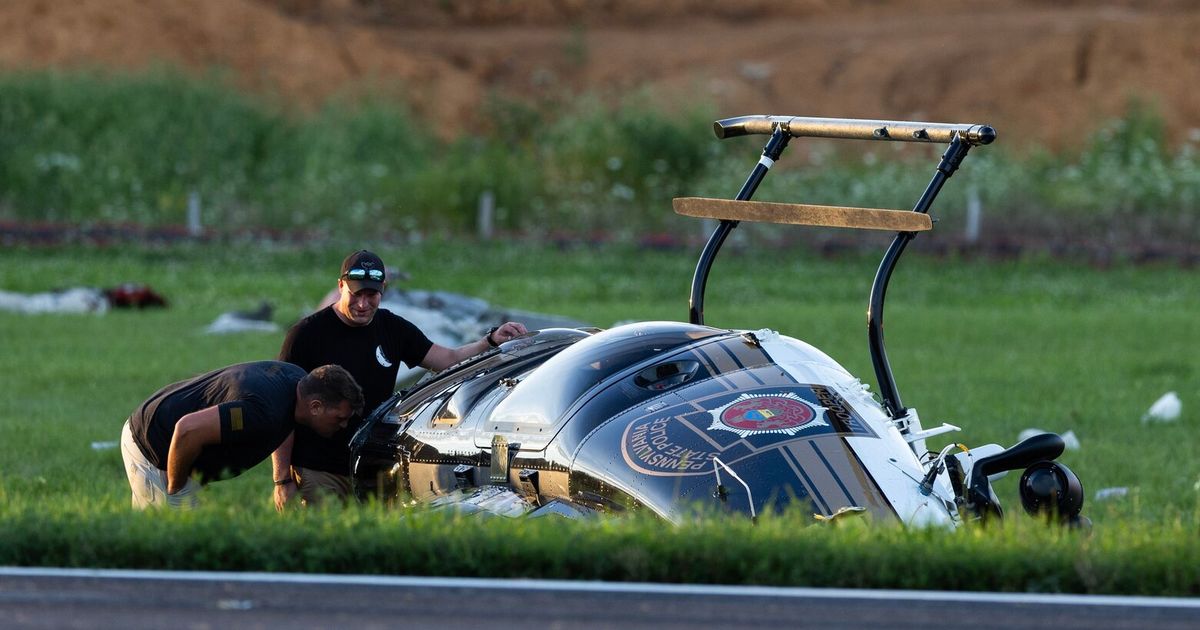 Investigators probe a dramatic midair crash as a landing plane hits hovering police helicopter