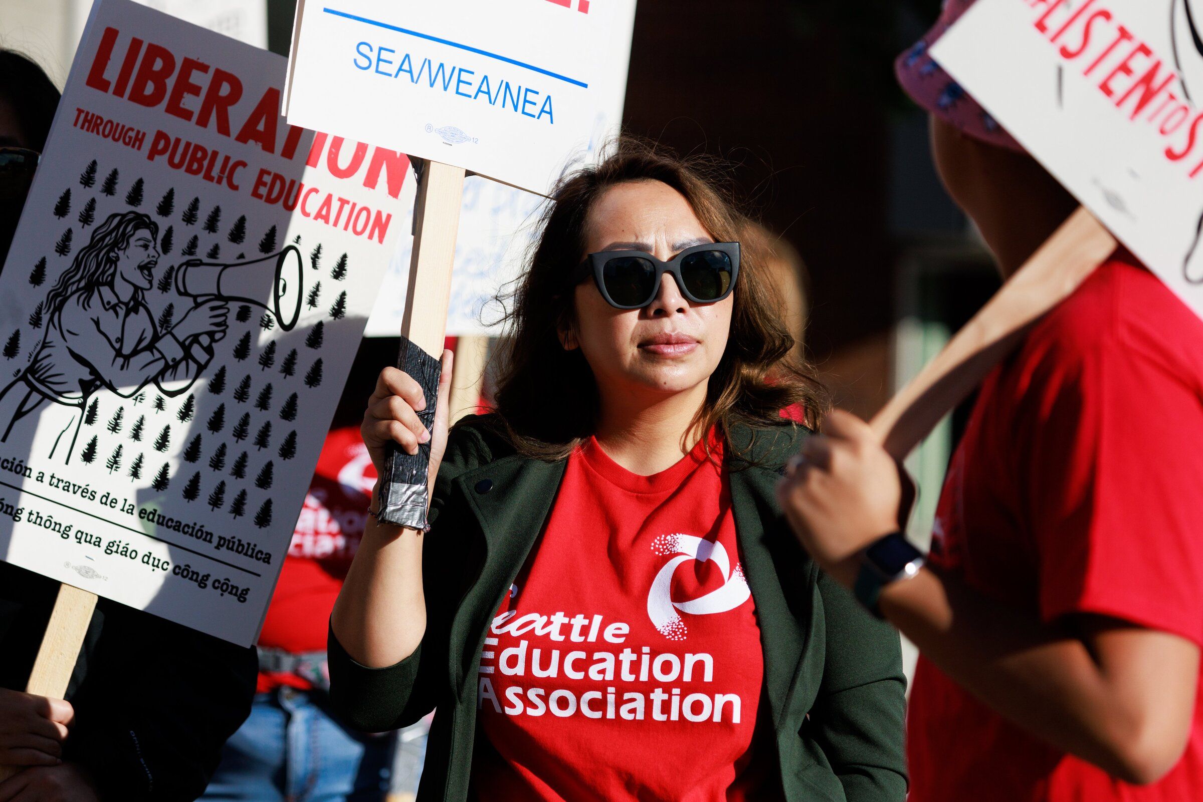 C.C. Saeteurn and others gather in front of Cleveland High School during the last teachers strike in Seattle, in 2022. (Erika Schultz / The Seattle Times)