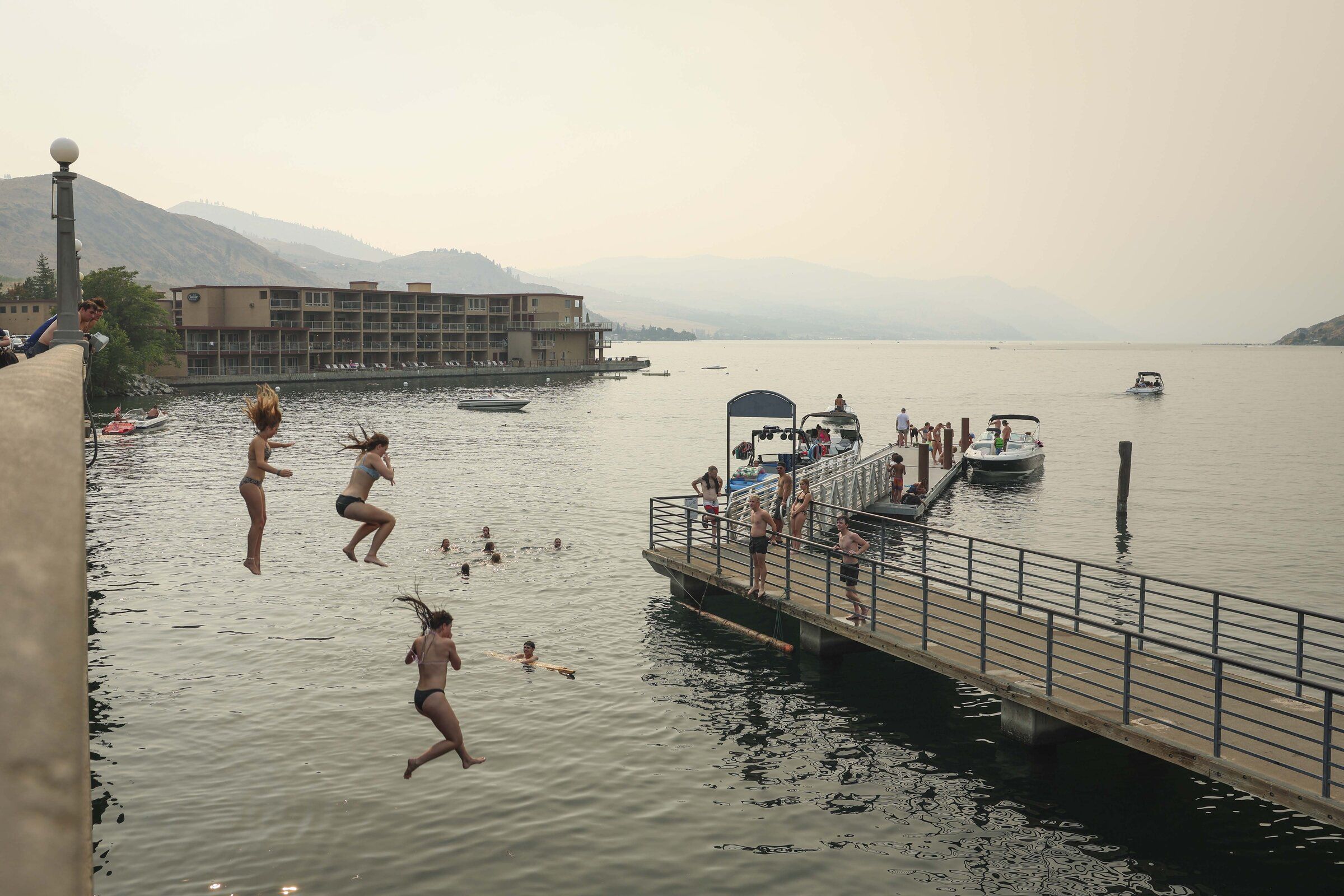 Swimmers jump into Lake Chelan on Thursday, Aug. 20. (Ivy Sebayo / The Seattle Times)