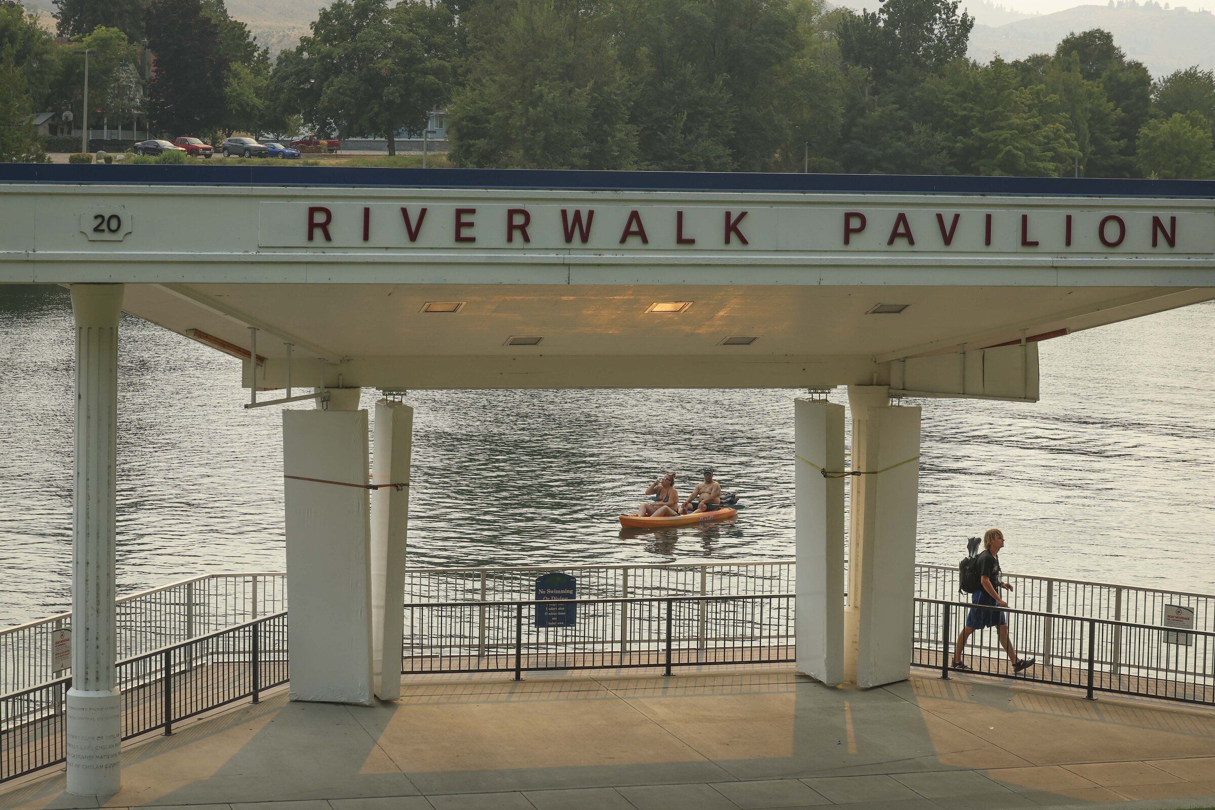 People visit Chelan Riverwalk Park on Thursday, Aug. 20. (Ivy Sebayo / The Seattle Times)