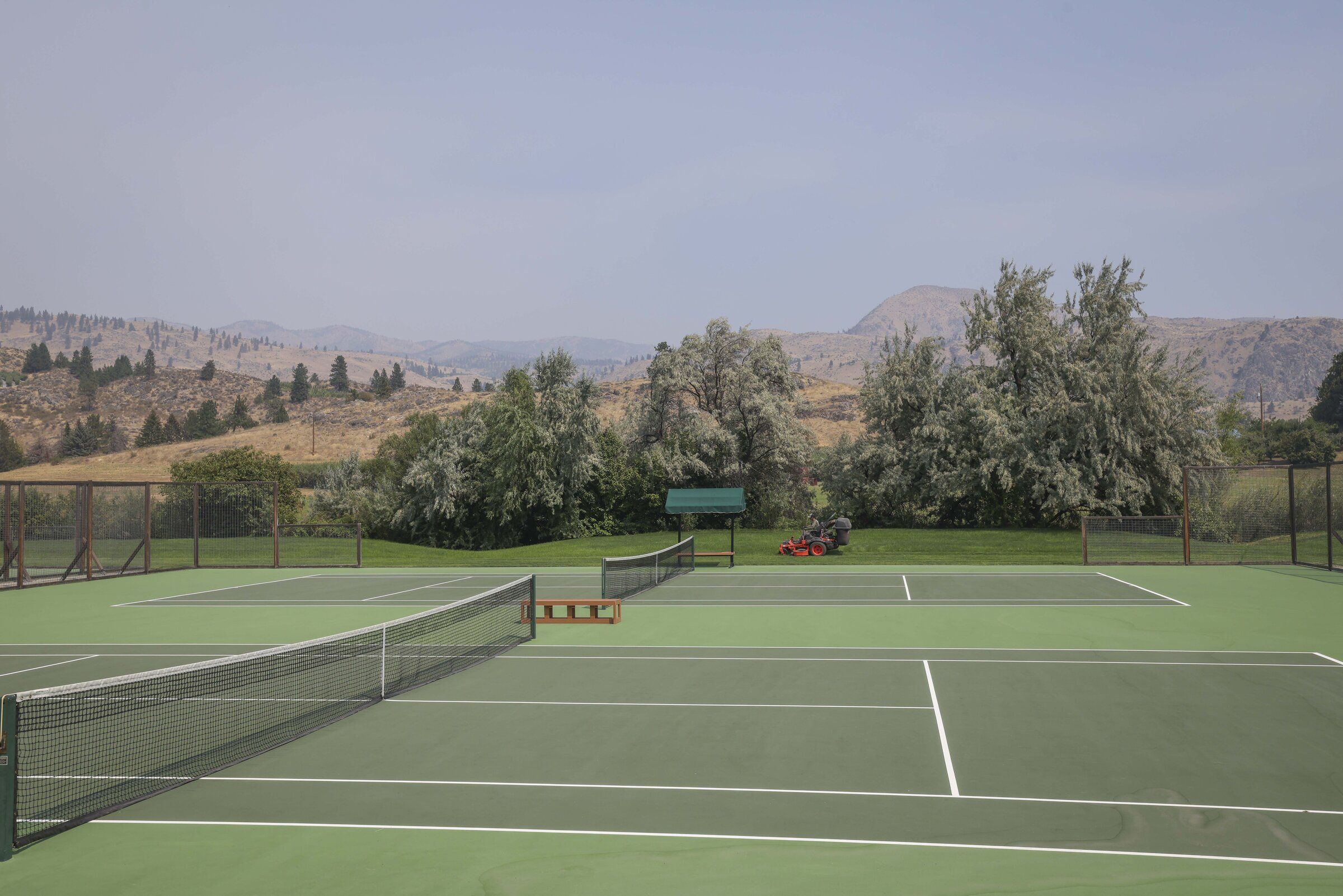 Wildfire smoke shrouds the sky above the scenic Harmony Meadows Tennis Resort in Manson on Thursday, Aug. 20. (Ivy Sebayo / The Seattle Times)