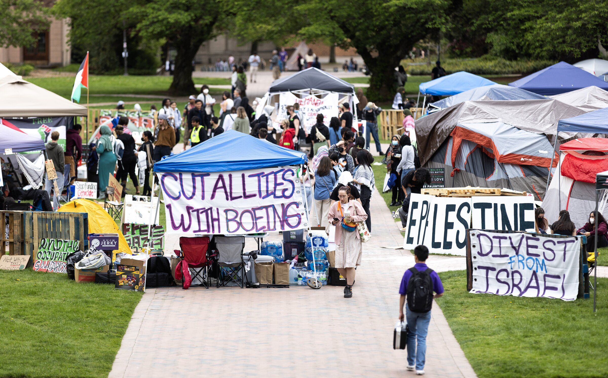 People gather inside the “Liberated Zone in Solidarity with Palestine” in the Quad on the University of Washington campus on May 3, 2024, in Seattle. (Nick Wagner / The Seattle Times)
