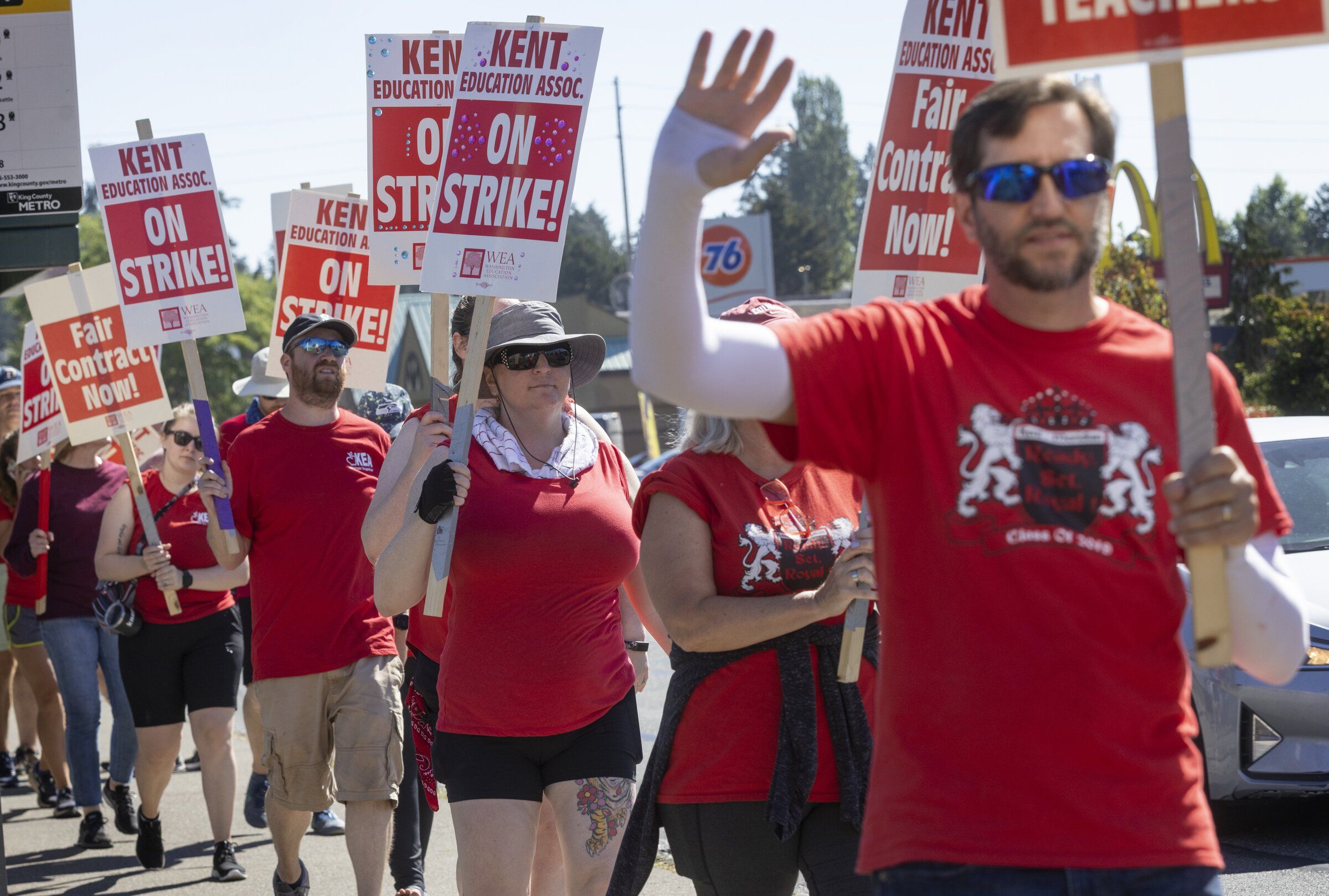 Teachers picket outside Kent Meridian High School in Kent in August 2022. Unions for educators in school districts around Puget Sound have been locked in thorny negotiations. (Ellen M. Banner / The Seattle Times)