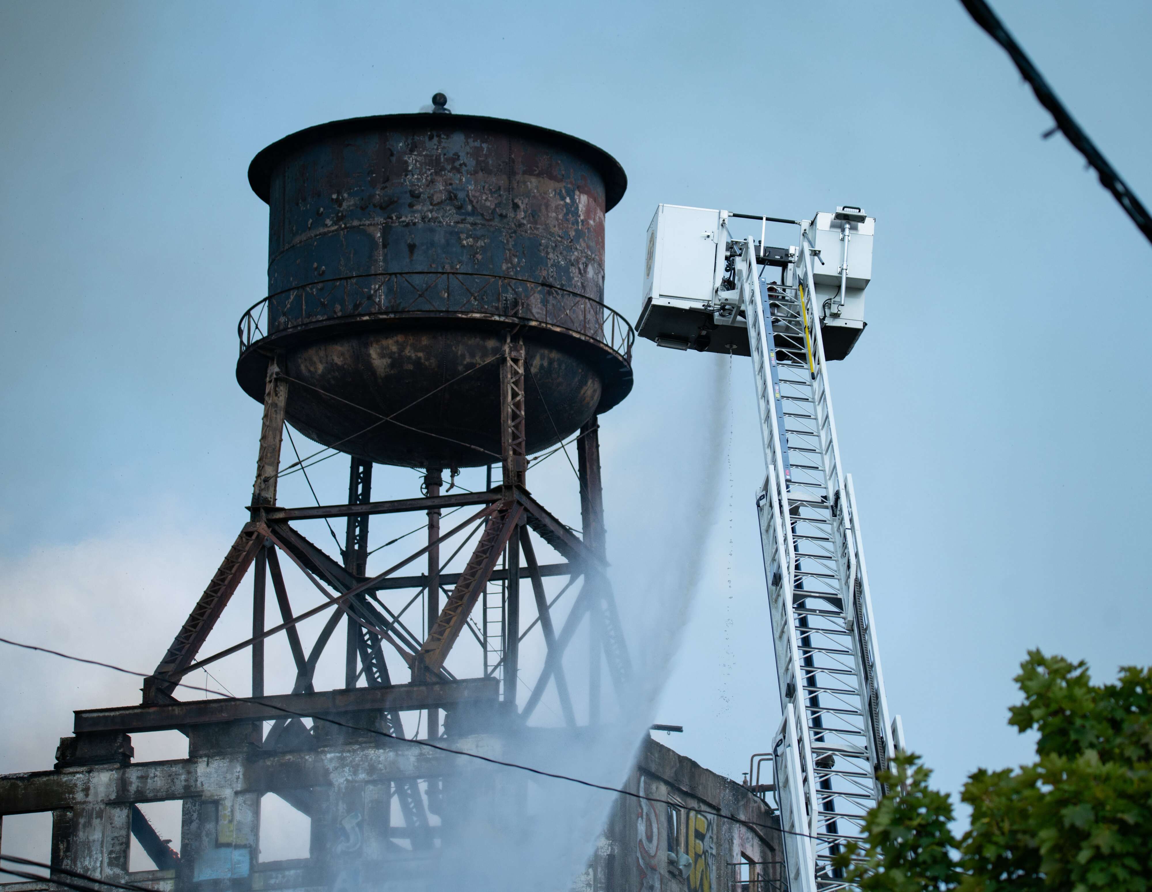 Firefighters battle a blaze at the long-abandoned Centennial Mills warehouse on Northwest Naito Parkway in Portland on Sunday, Aug. 2, 2026. (Tatum Todd | The Oregonian/oregonlive.com/TNS)