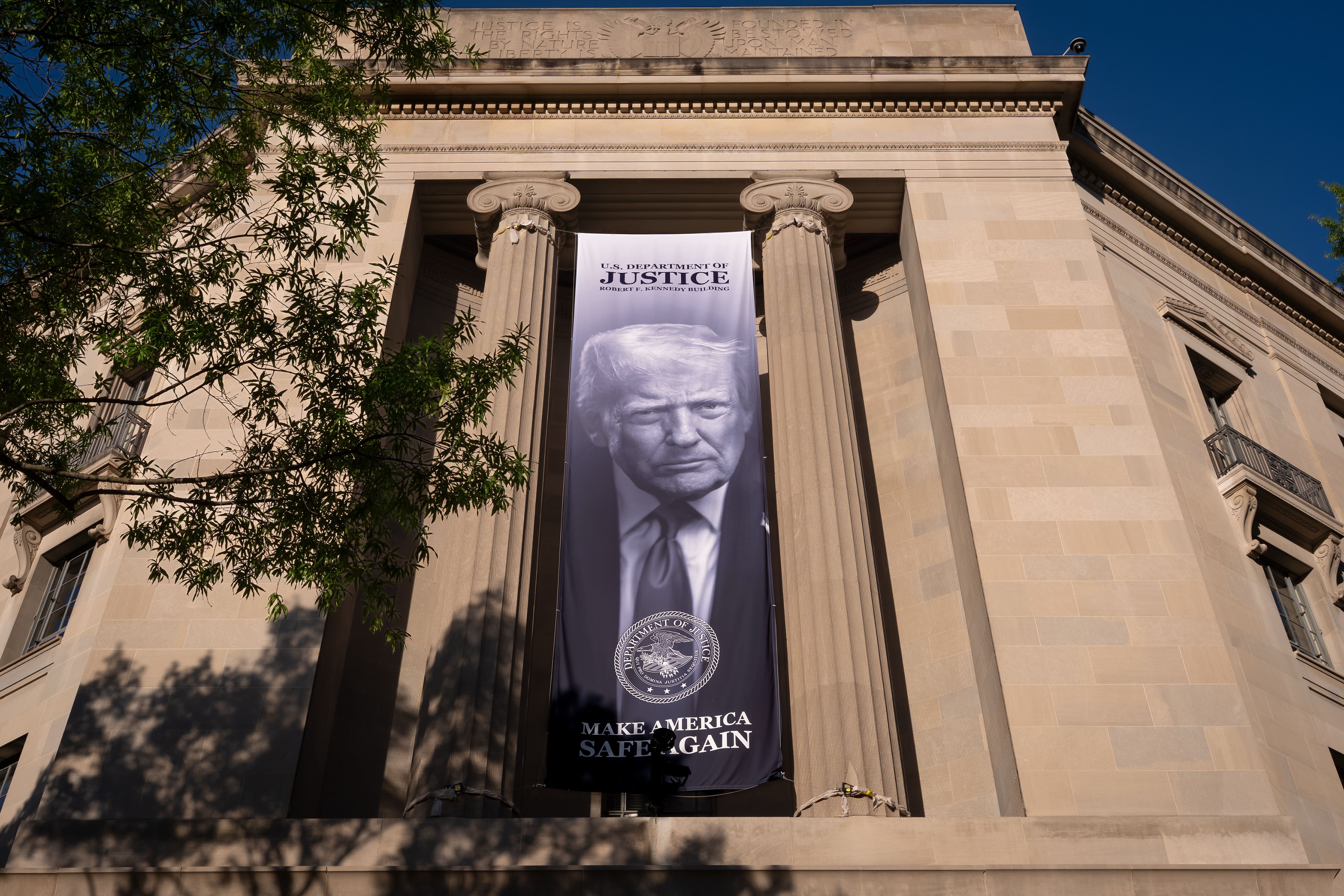 A portrait of President Donald Trump is displayed at the Justice Department building in Washington, D.C., on June 2. (J. Scott Applewhite / The Associated Press)
