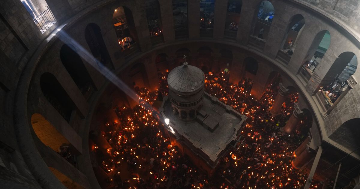 An AP reporter spends the night locked inside Jerusalem’s holiest church with clergy and pilgrims