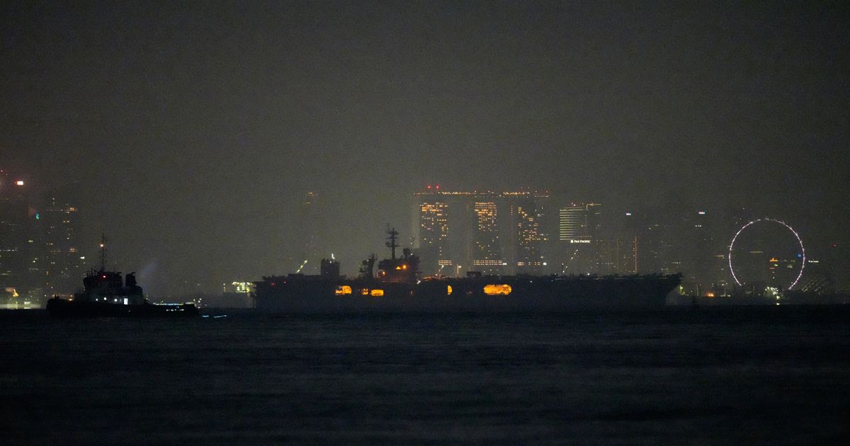 USS Abraham Lincoln sails past Singapore on its way home from Middle East
