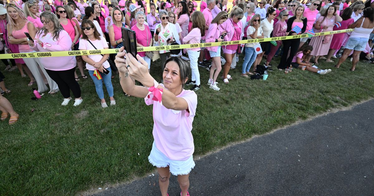 Women in pink rally in support of Lindsay Clancy who is on trial for killing 3 children
