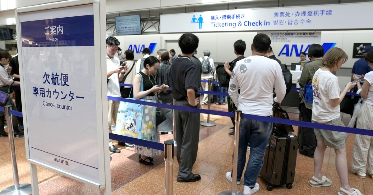 Tropical storm hits Tokyo area, leaving thousands without power before moving west