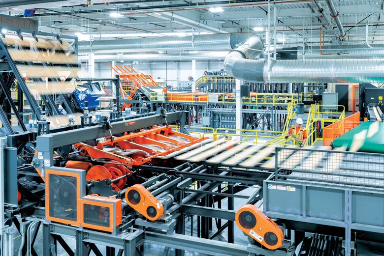 At Mercer Mass Timber’s Spokane factory, each board undergoes evaluation and tracking during the manufacturing process, ensuring material traceability and quality assurance. (Kristopher Grunert)