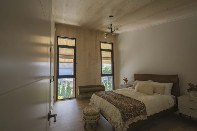 Ample natural light illuminates the cross-laminated timber interior of a Kenmore house. (Ivy Ceballo / The Seattle Times)