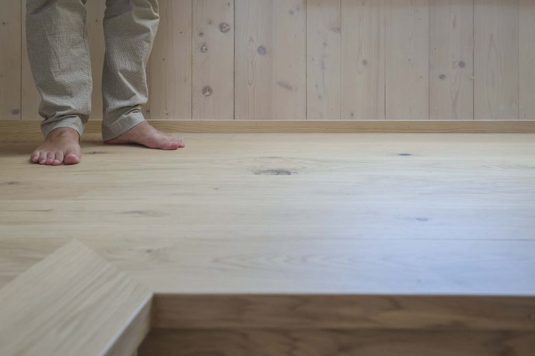 Mass timber building products embrace the look of the grain and layers of lumber. Shown is a Kenmore house designed by atelierjones. (Ivy Ceballo / The Seattle Times)