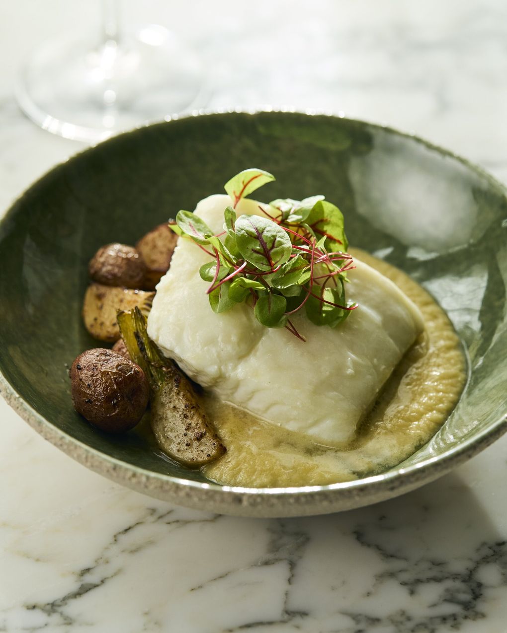 Spinasse’s halibut is poached in butter.  (Charity Burggraaf / For Spinasse)