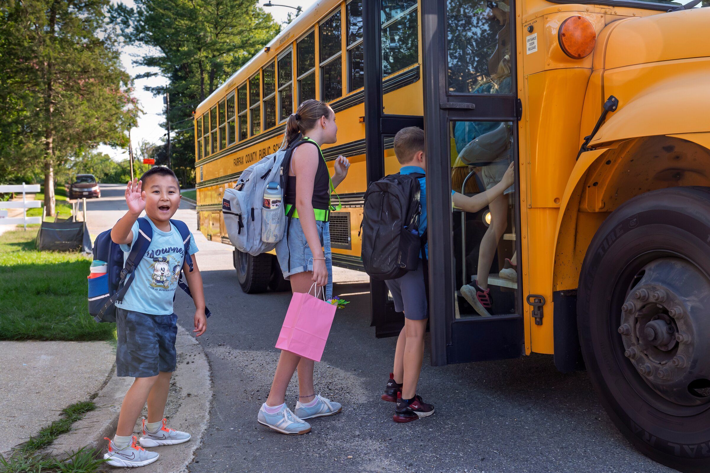 Children board the school bus on the first day of classes in Fairfax County, Va., on Aug. 24. (AP Photo/J. Scott Applewhite)
