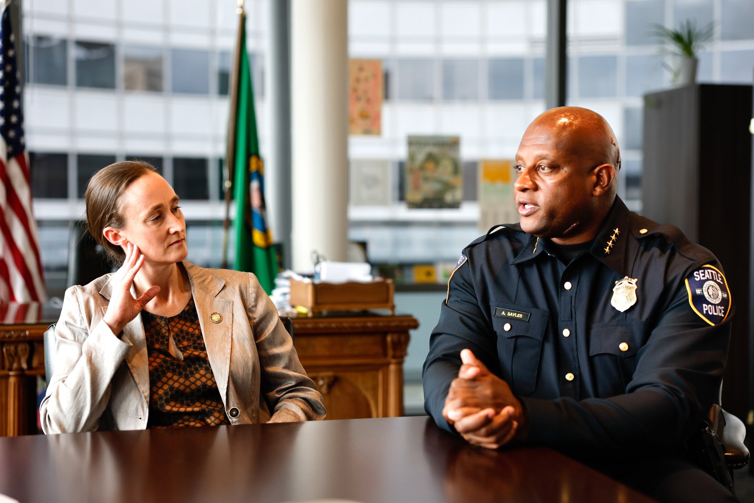 Seattle Mayor Katie Wilson and interim Seattle police Chief Andre Sayles discuss communication issues related to the Bite of Seattle shooting, and what Sayles plans for his first 100 days in office, on Tuesday. (Karen Ducey / The Seattle Times)