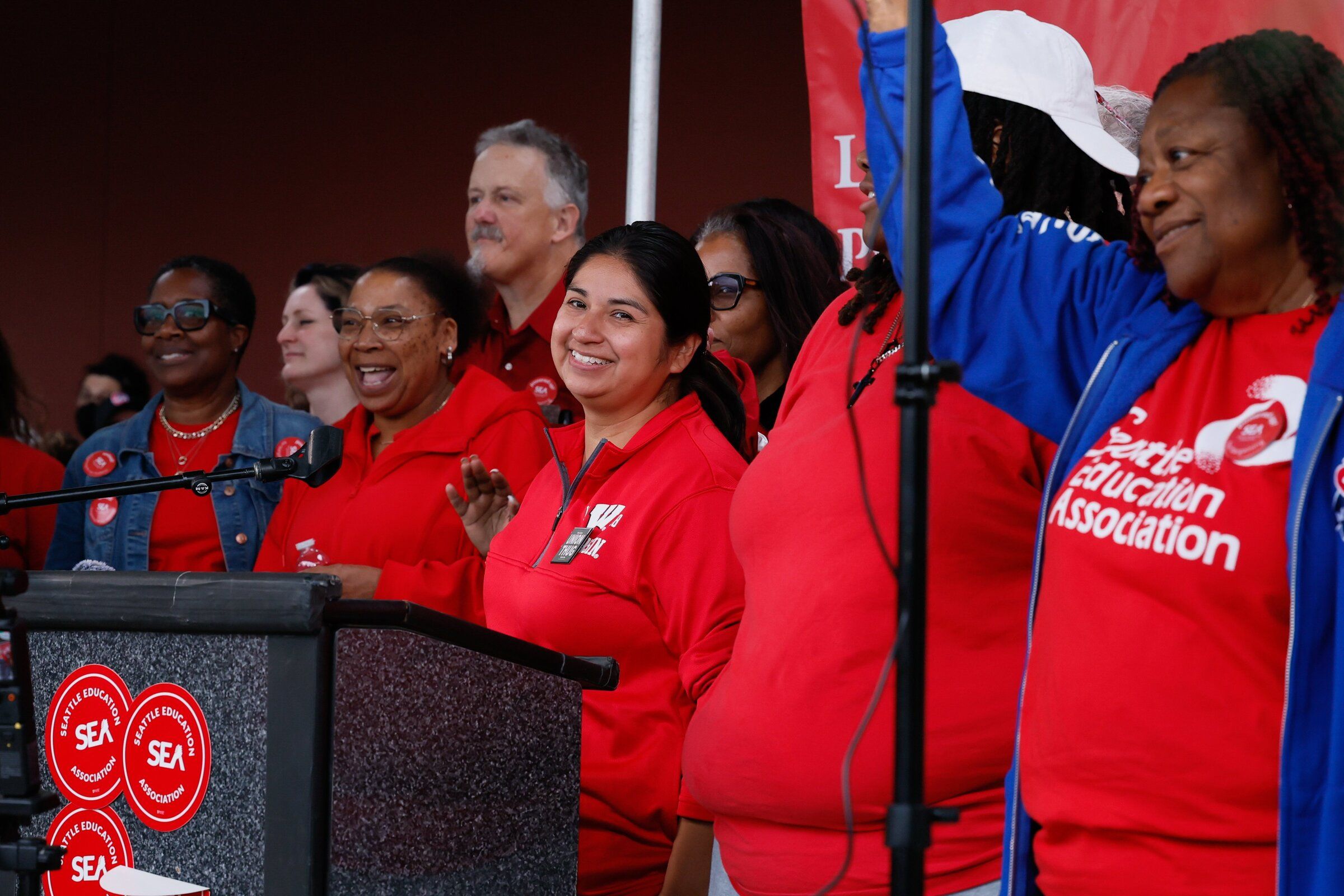 Members of the Seattle Education Association bargaining committee are acknowledged by the crowd during a rally outside Seattle Public Schools’ headquarters on Tuesday. (Jennifer Buchanan / The Seattle Times)