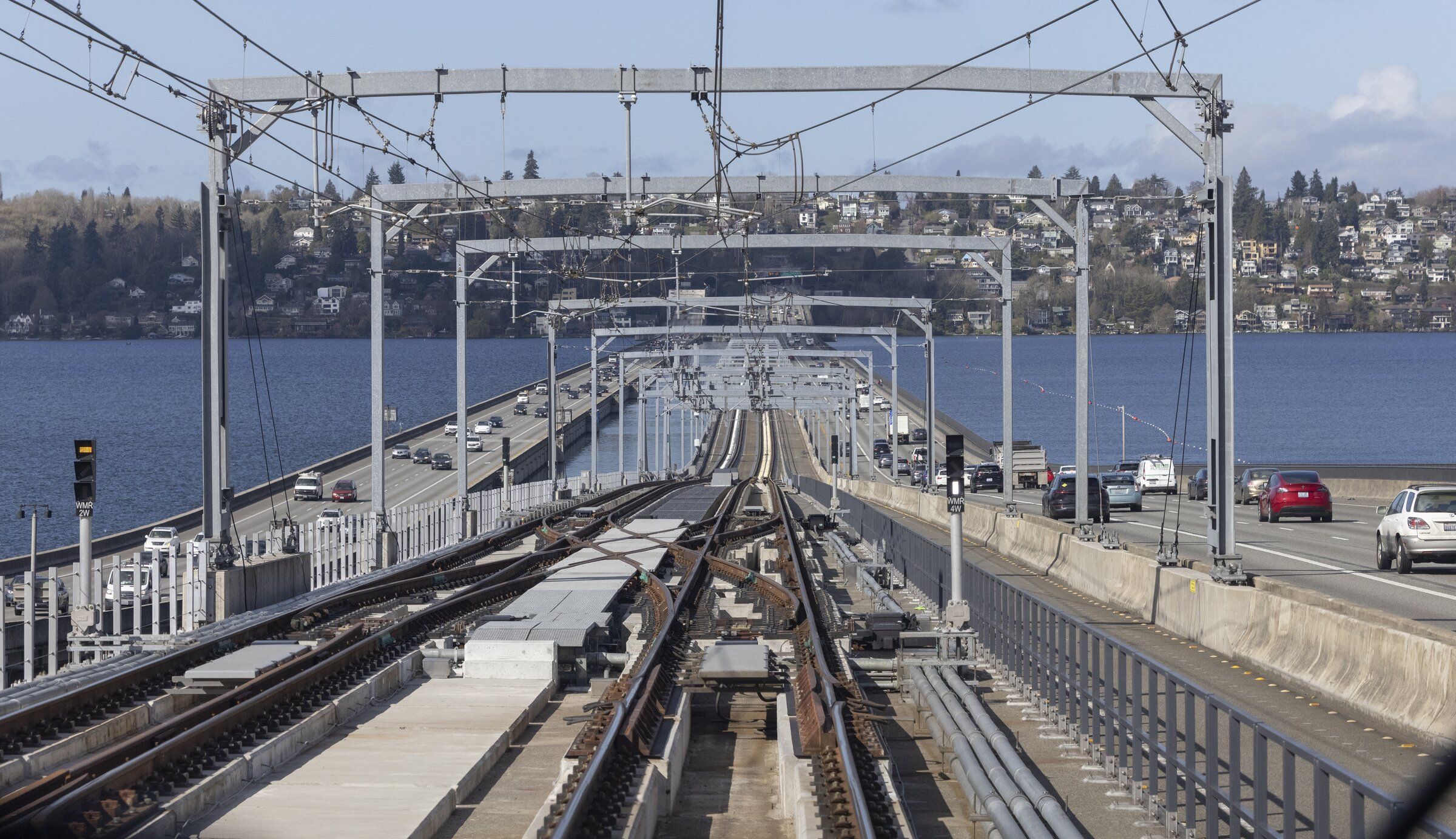 Sound Transit’s new light-rail track across Lake Washington runs alongside the westbound lanes of Interstate 90. (Ellen M. Banner / The Seattle Times)