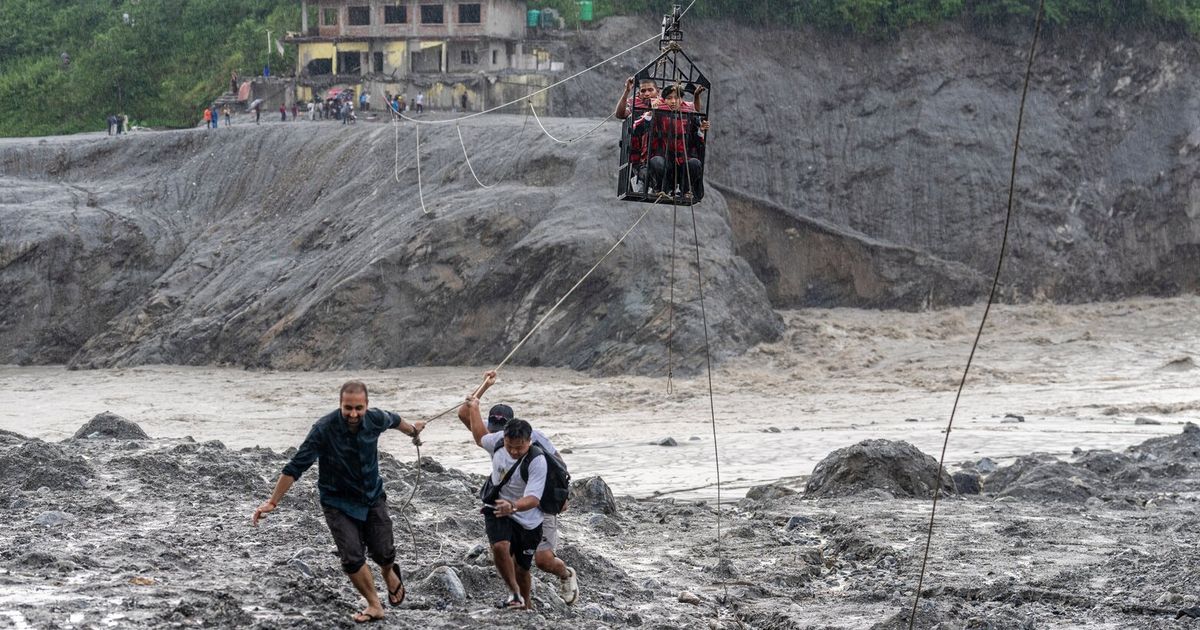 Rescuers pull 2 trapped workers from a hydropower tunnel 9 days after Nepal floods