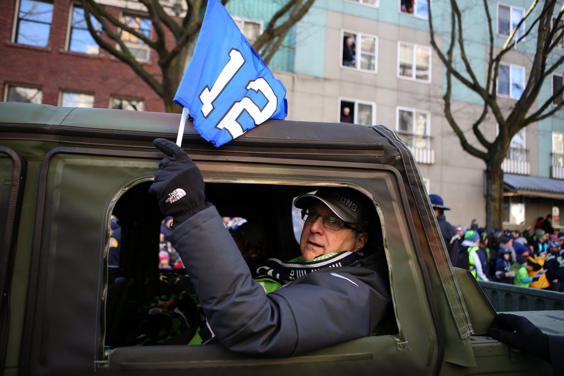 Seahawks co-owner Paul Allen rides in the victory parade following the 2014 Super Bowl. (Ken Lambert / The Seattle Times)