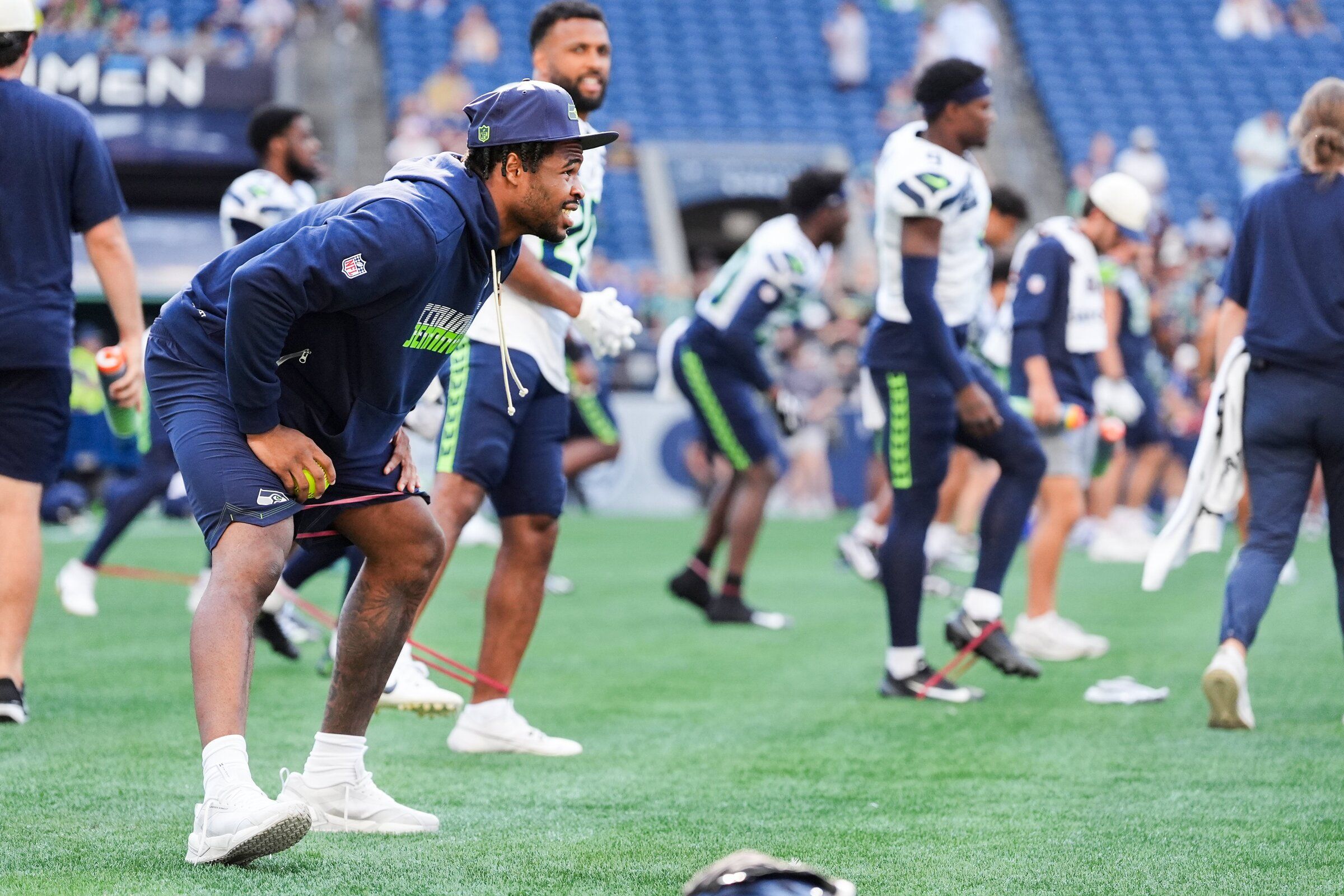 Seahawks safety Nick Emmanwori, left, warms up during the team’s practice at Lumen Field on Aug. 8. (Lindsey Wasson / Associated Press)