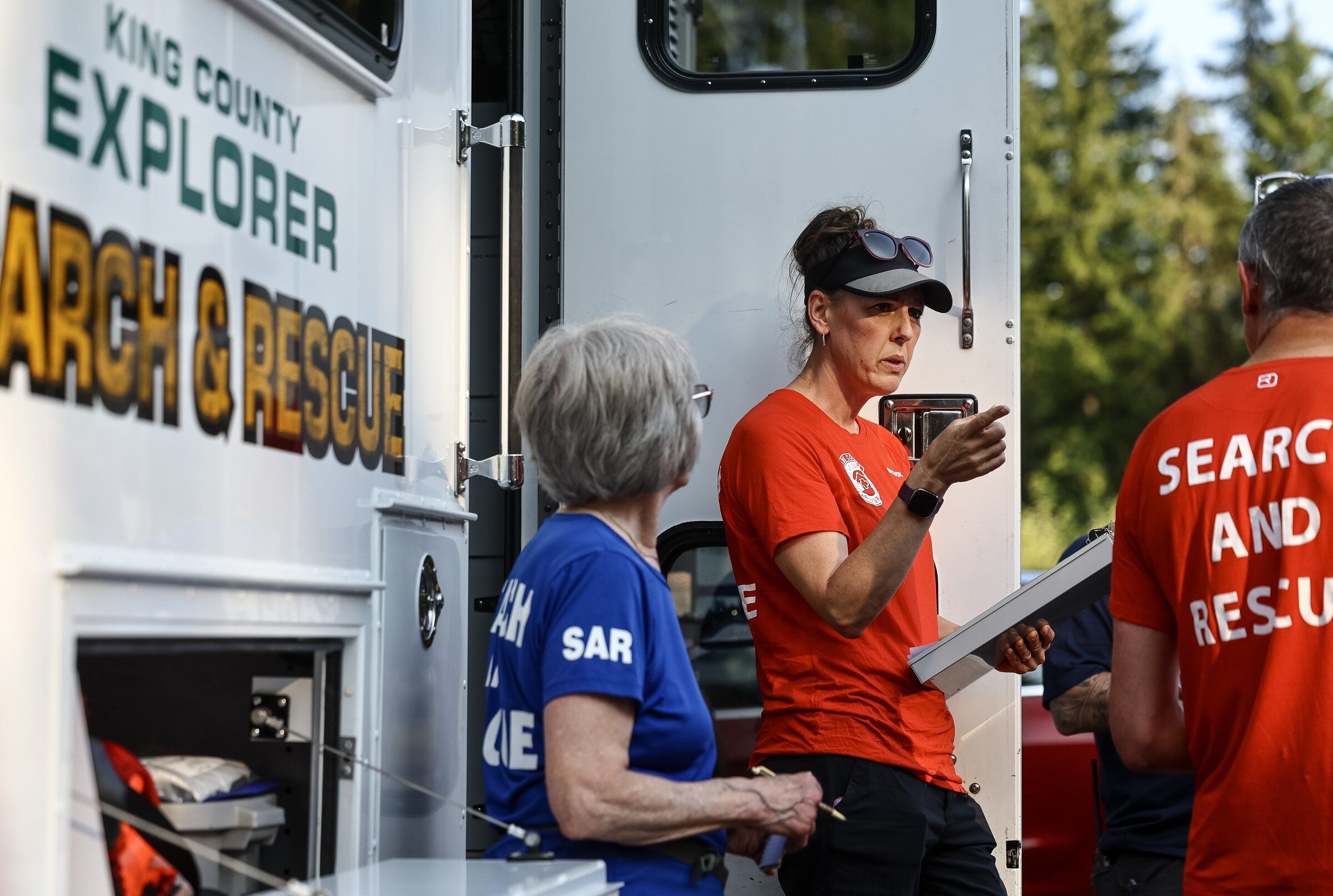 Julie Vartes, operations leader for King County Search and Rescue, instructs team members during a search-and-rescue exercise in July near North Bend. (Nick Wagner / The Seattle Times)