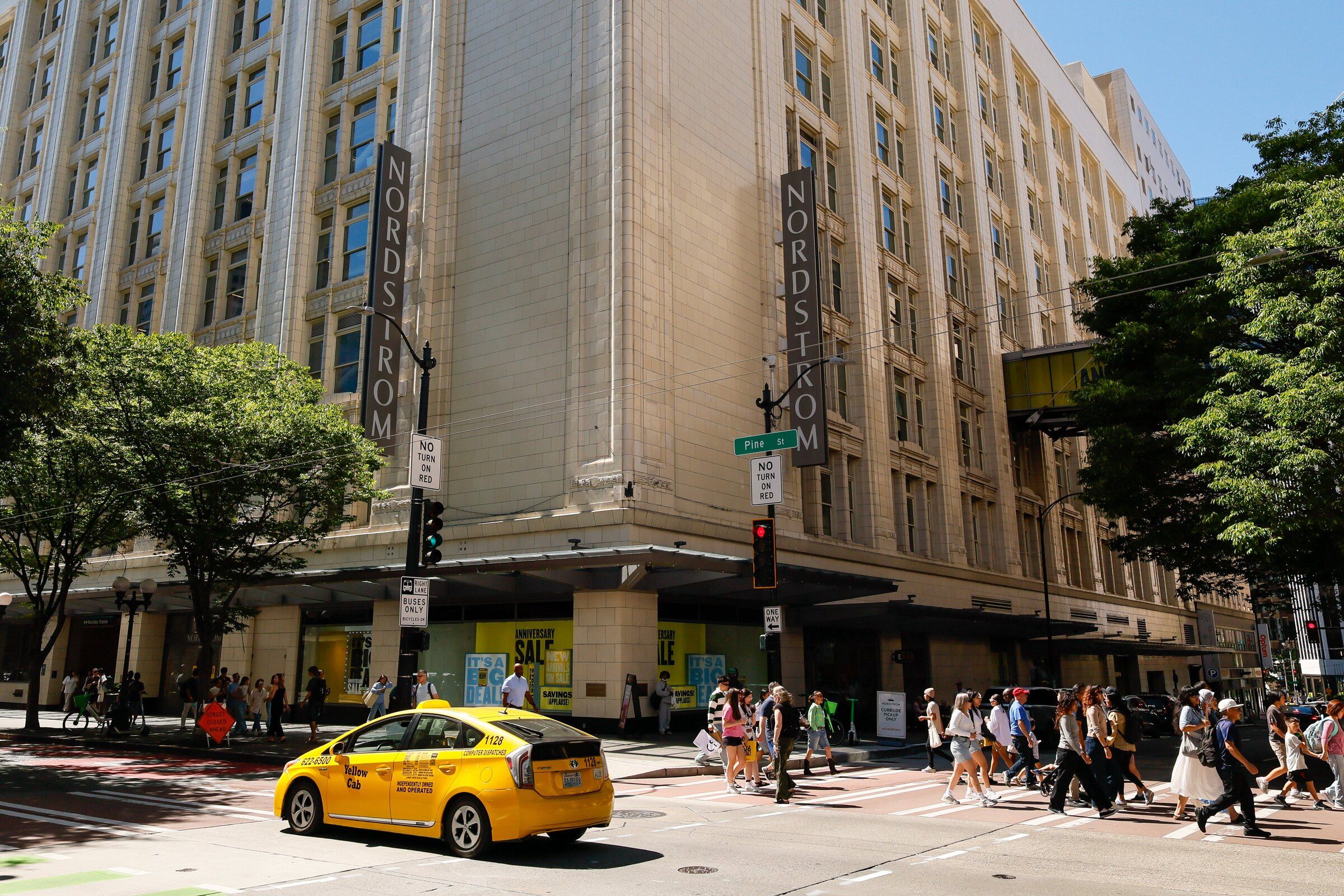 Nordstrom’s flagship store on Pine Street. The company said it called 911 70 times this year because of thefts and disorder at its downtown Seattle store, but police usually did not respond. Are we really asking too much of Seattle? (Jennifer Buchanan / The Seattle Times, 2025)