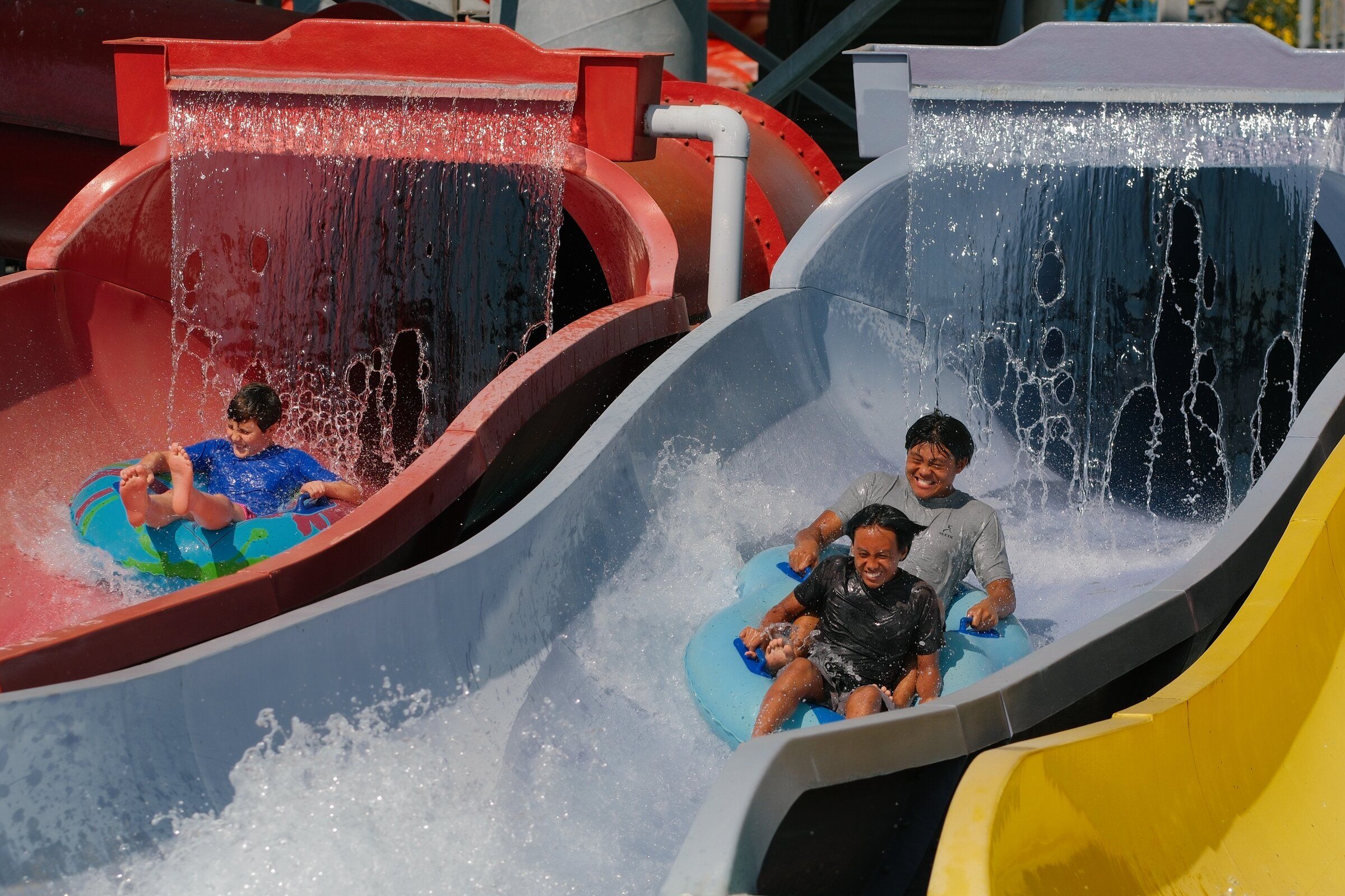 Inner-tube riders slide down the Konga Slides at Wild Waves on Aug. 18. (Genna Martin / special to The Seattle Times)