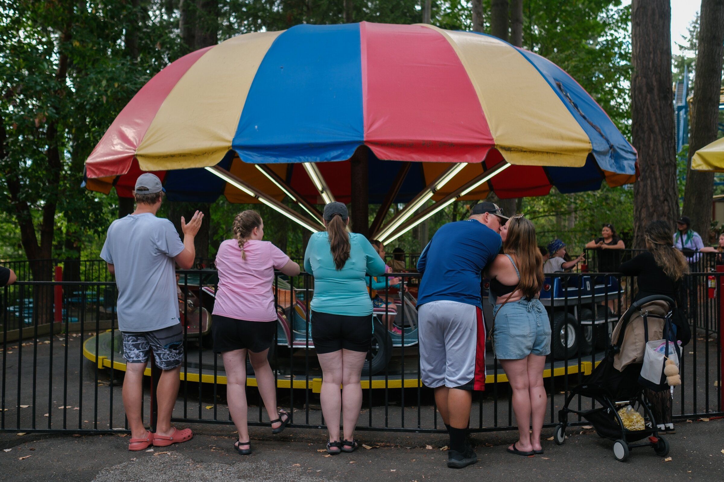 Parents watch their children on the Kiddie Combo ride at Wild Waves on Aug. 29. (Genna Martin / special to The Seattle Times)
