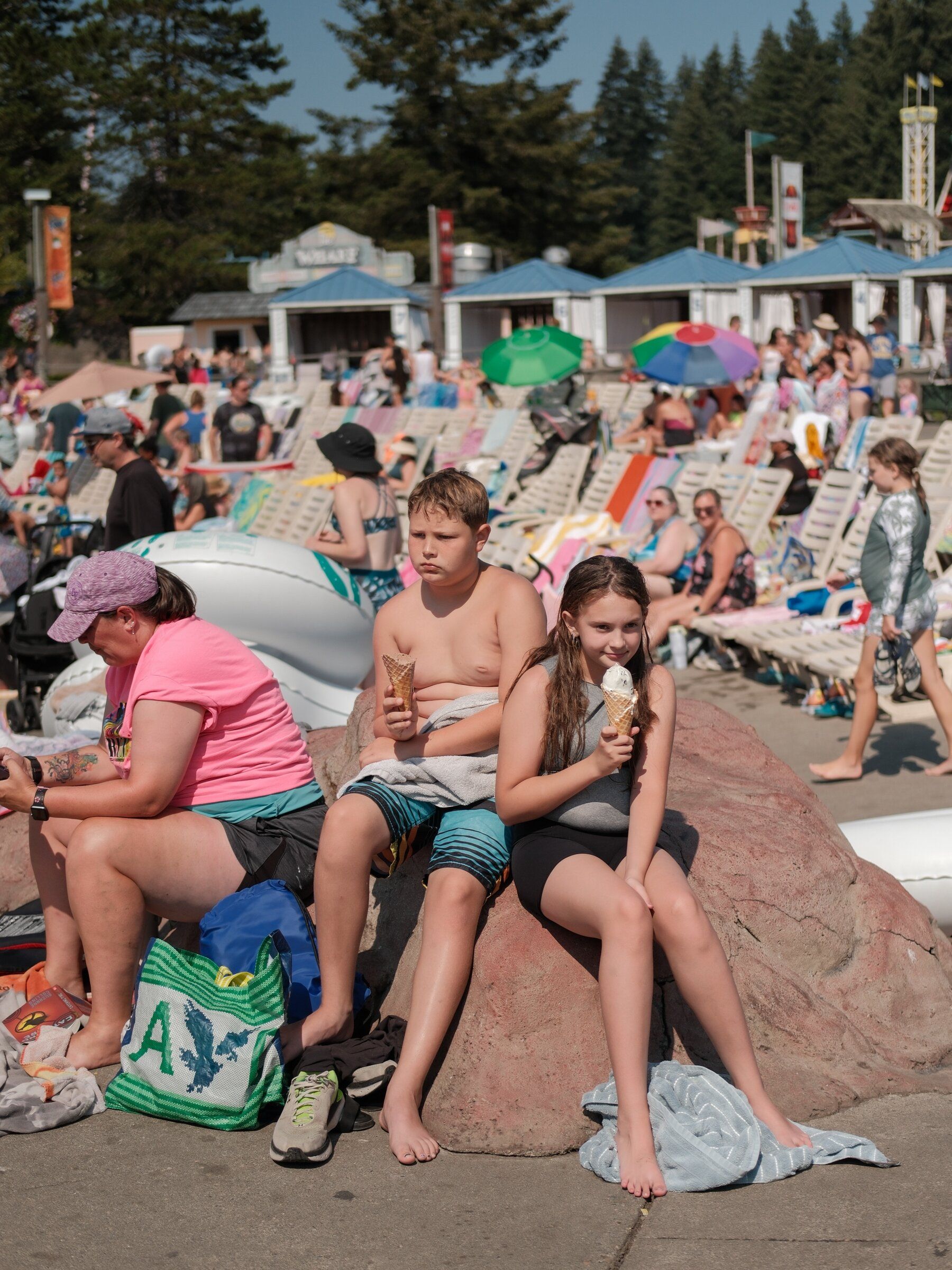Dean Duncan, 11, and Liberty Glentz, 11, eat ice cream at Wild Waves in Federal Way. Duncan has been going to Wild Waves since he was 6. (Genna Martin / special to The Seattle Times)
