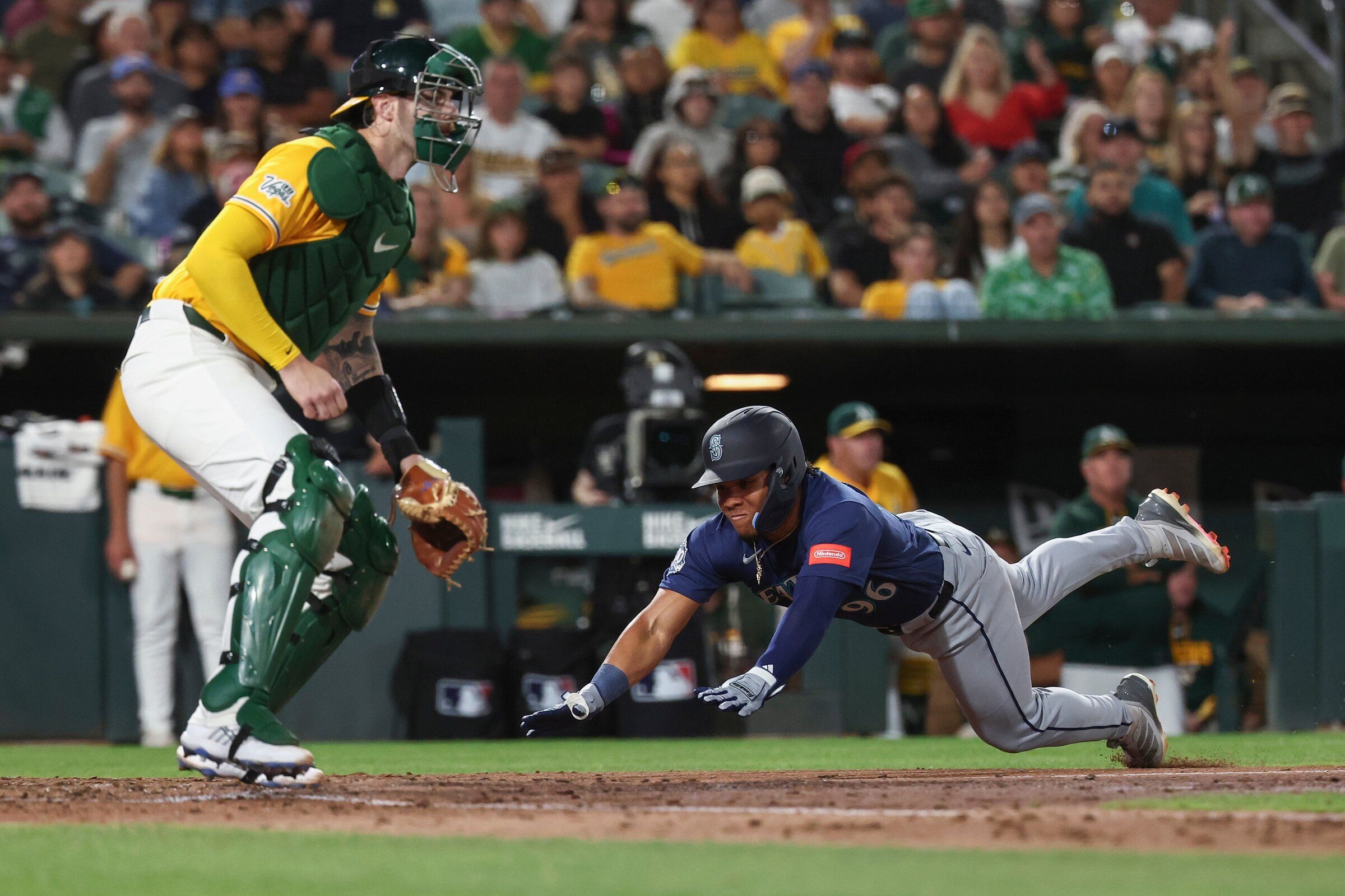 Seattle Mariners’ Michael Arroyo slides safely into home plate during the fourth inning of a baseball game against the Athletics on Saturday, September 12, 2026, in West Sacramento, California. (Sarah Nevis / AP)
