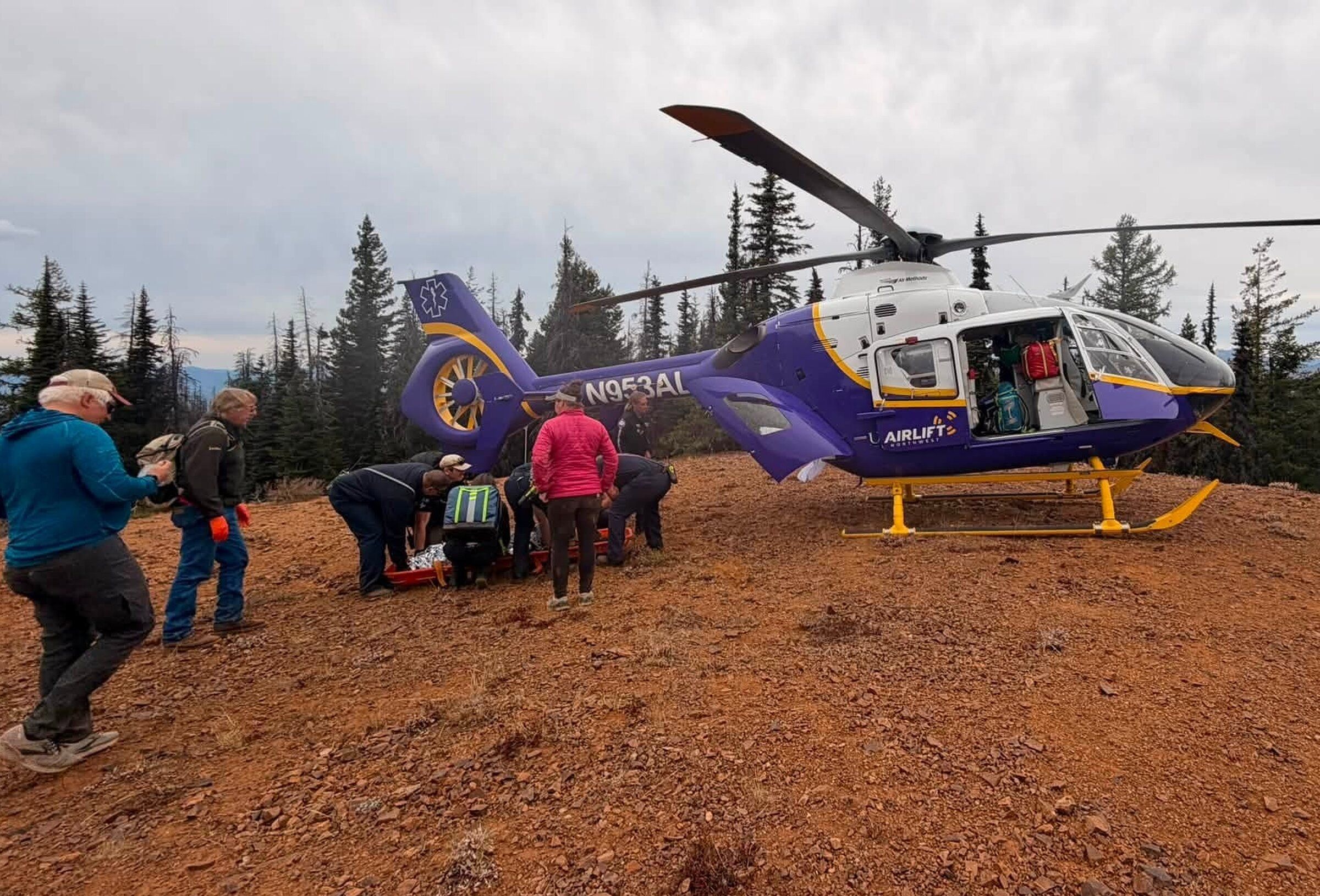 First responders transfer a 9-year-old girl, who suffered a serious leg injury at the Red Top Lookout trail, to Harborview Medical Center via airlift on Sept. 12. (Kittitas County Fire District 7)