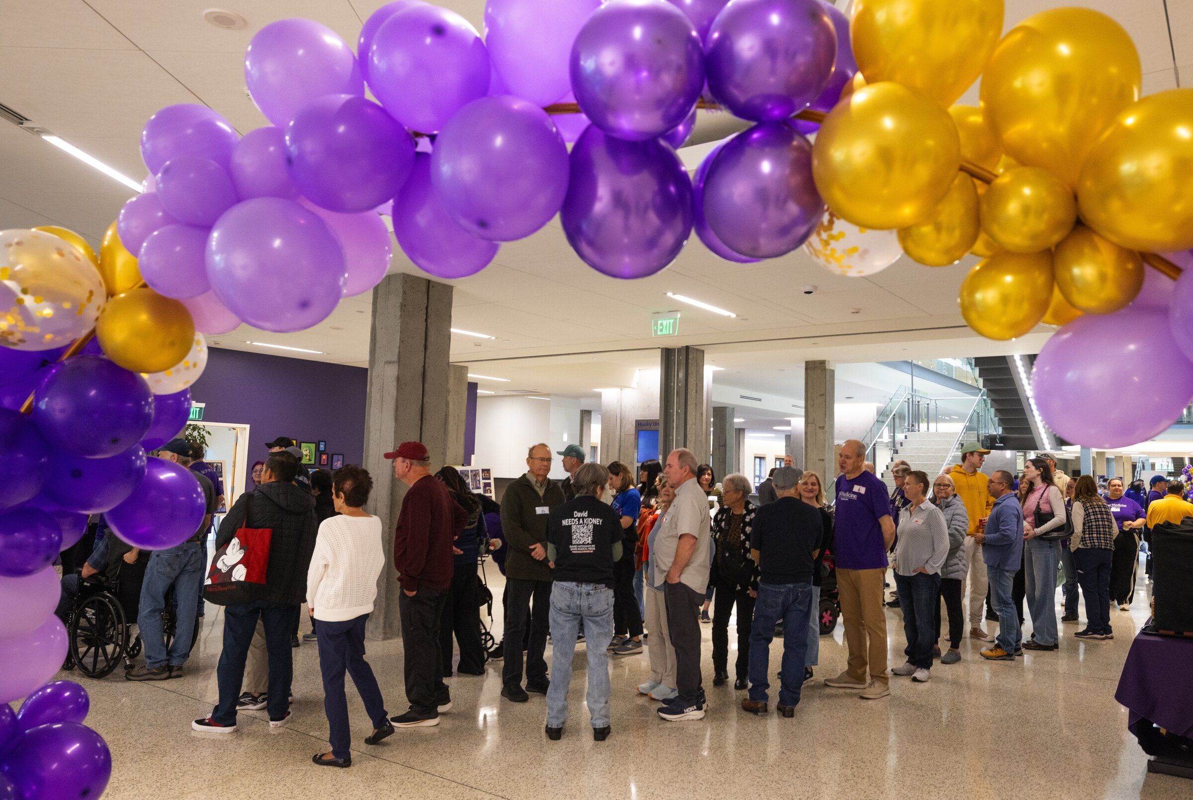People line up for food at a “transplant recipient picnic” held Sunday on the University of Washington campus in Seattle. (Ken Lambert / The Seattle Times)