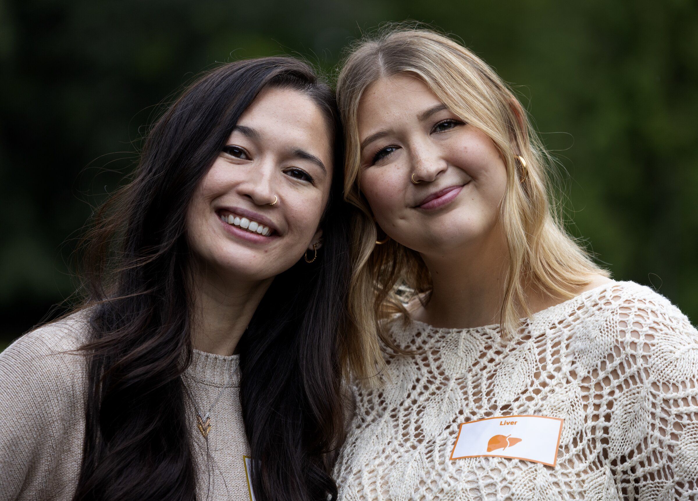 Taylor Schander, right, received a liver transplant from her older sister Kathleen, seen together during a “transplant picnic,” on Sunday on the University of Washington campus in Seattle. (Ken Lambert / The Seattle Times)