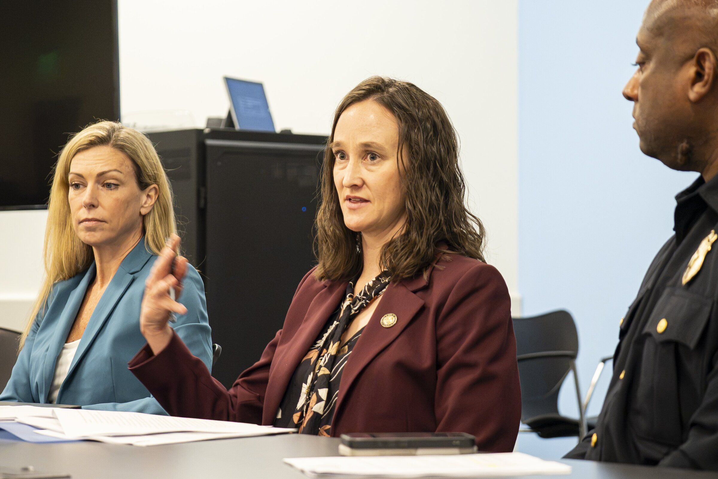 CARE Department Chief Amy Barden, Mayor Katie Wilson and interim Seattle police Chief Andre Sayles announce a gun violence reduction plan on Monday, emphasizing partnerships and violence intervention. (Kevin Clark / The Seattle Times)