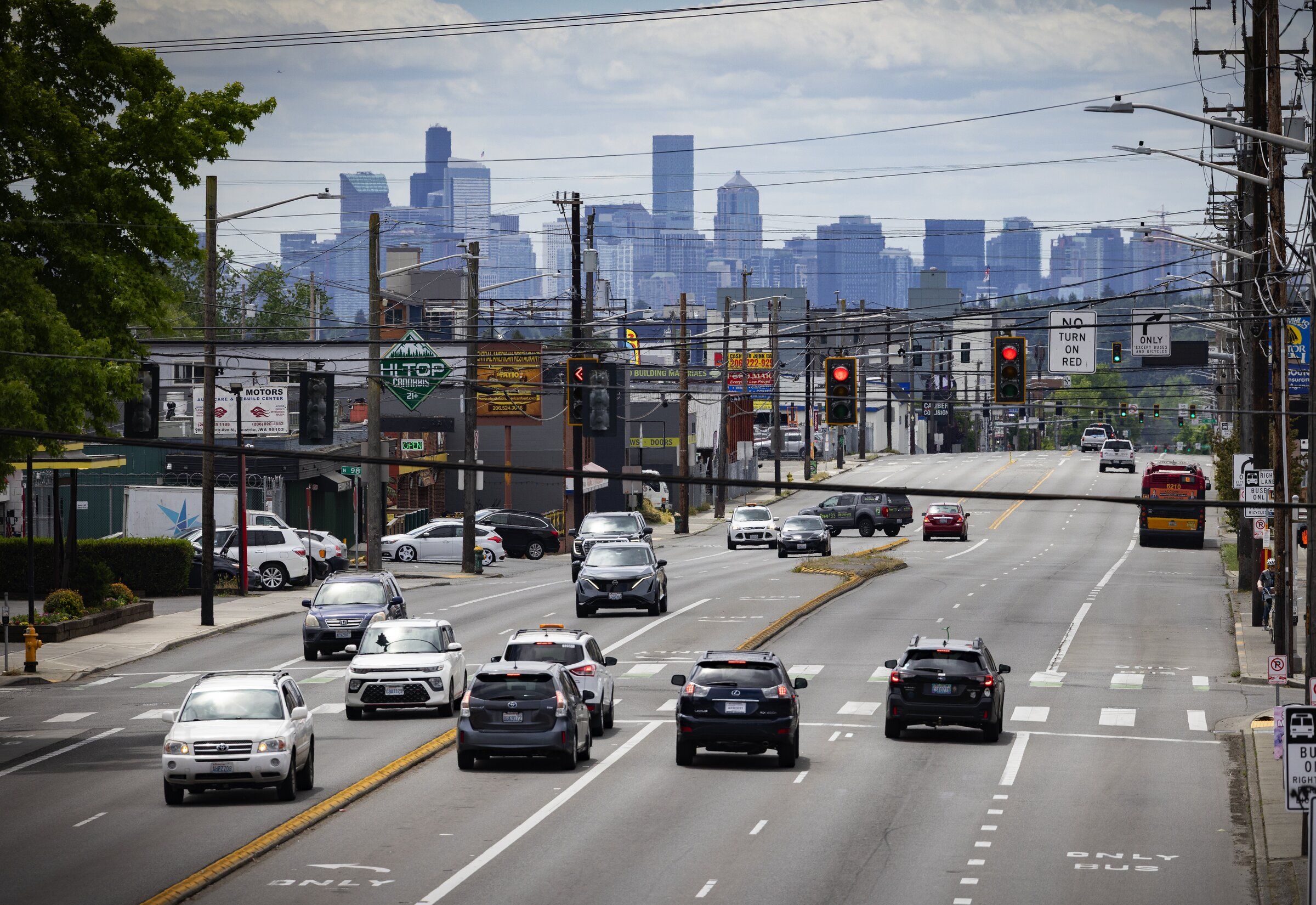 Downtown Seattle rises in the background of a view of Aurora Avenue North on June 4. (Ken Lambert / The Seattle Times)